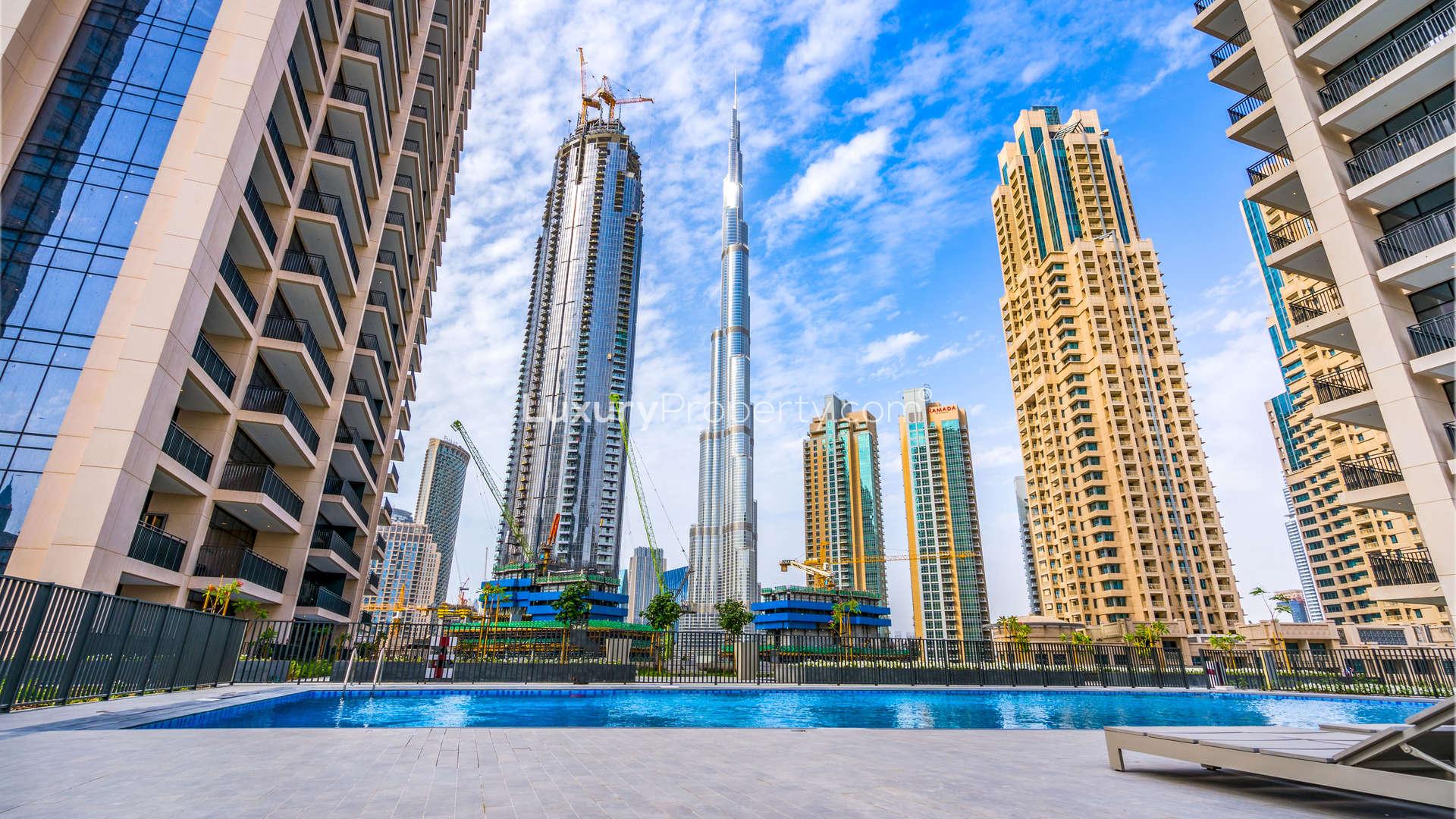 Balcony view from Boulevard Crescent apartment in Downtown Dubai, featuring cityscape and skyscrapers