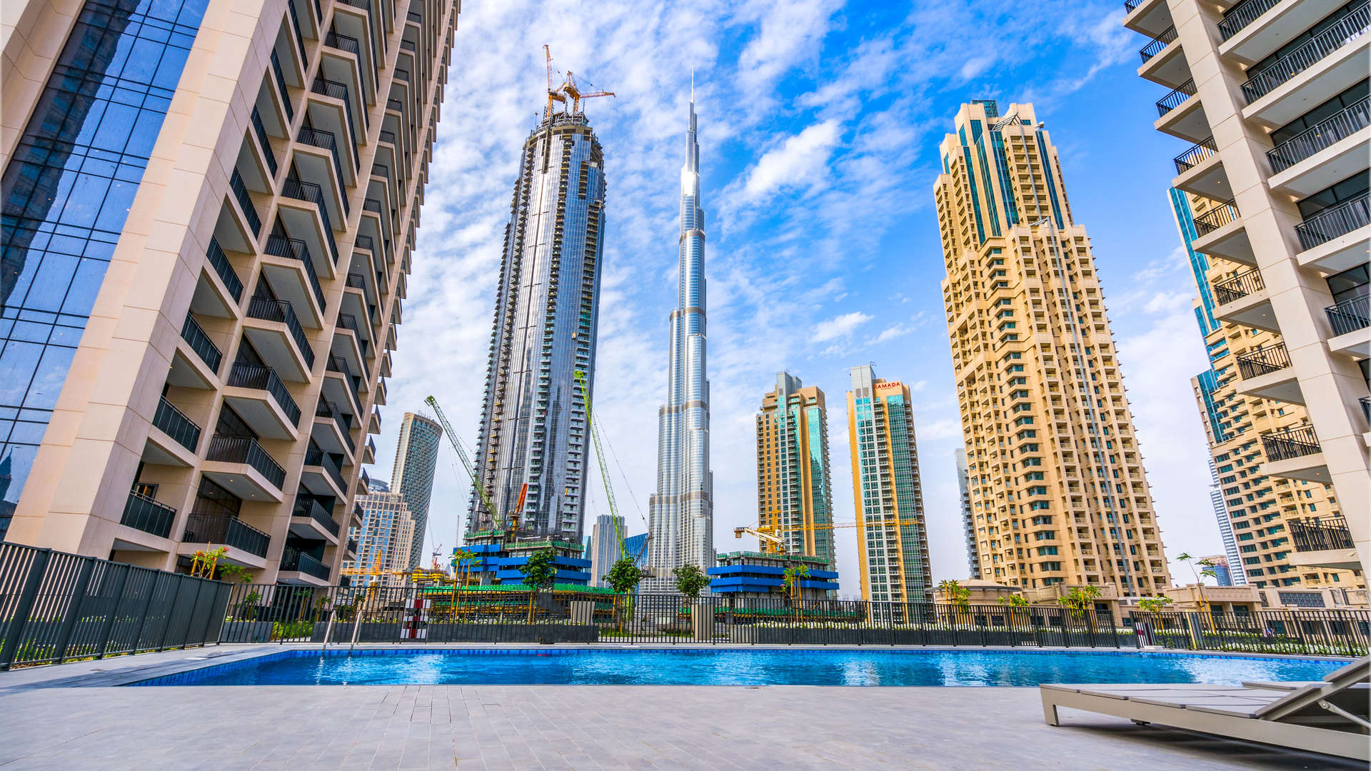 Balcony view from Boulevard Crescent apartment in Downtown Dubai, featuring cityscape and skyscrapers