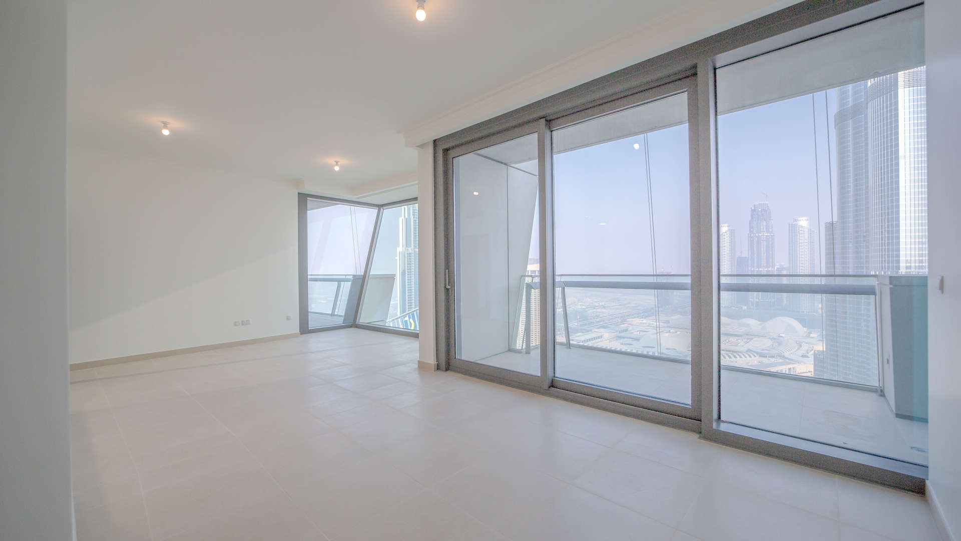 Immaculate Burj Vista Apartment living room with floor-to-ceiling windows, Downtown Dubai view