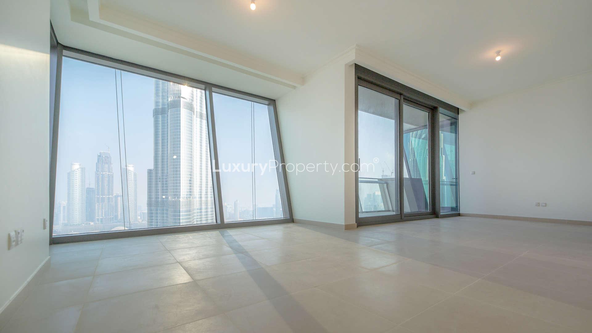 Luxurious Burj Vista apartment interior with floor-to-ceiling windows and stunning Downtown Dubai views