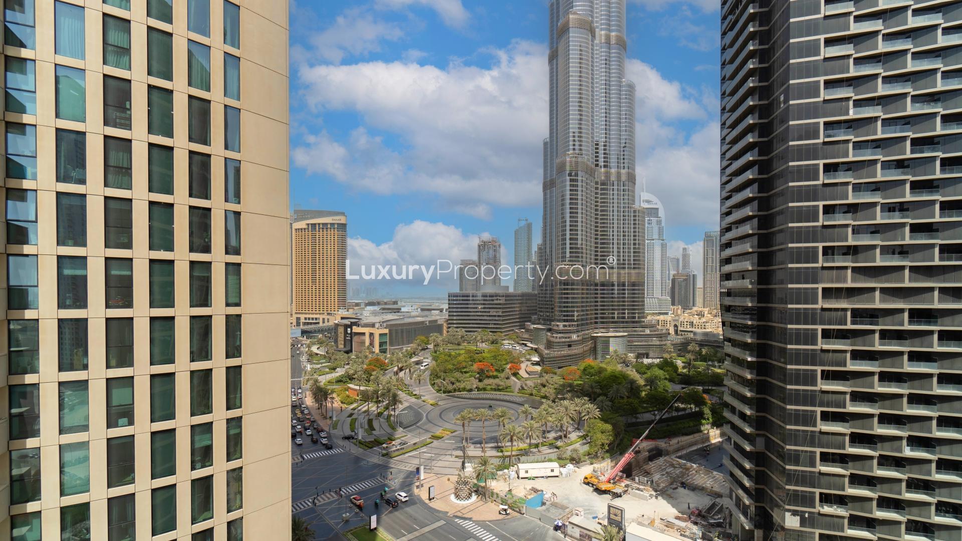Skyscrapers and palm trees in Downtown Dubai, view from Burj Vista apartment