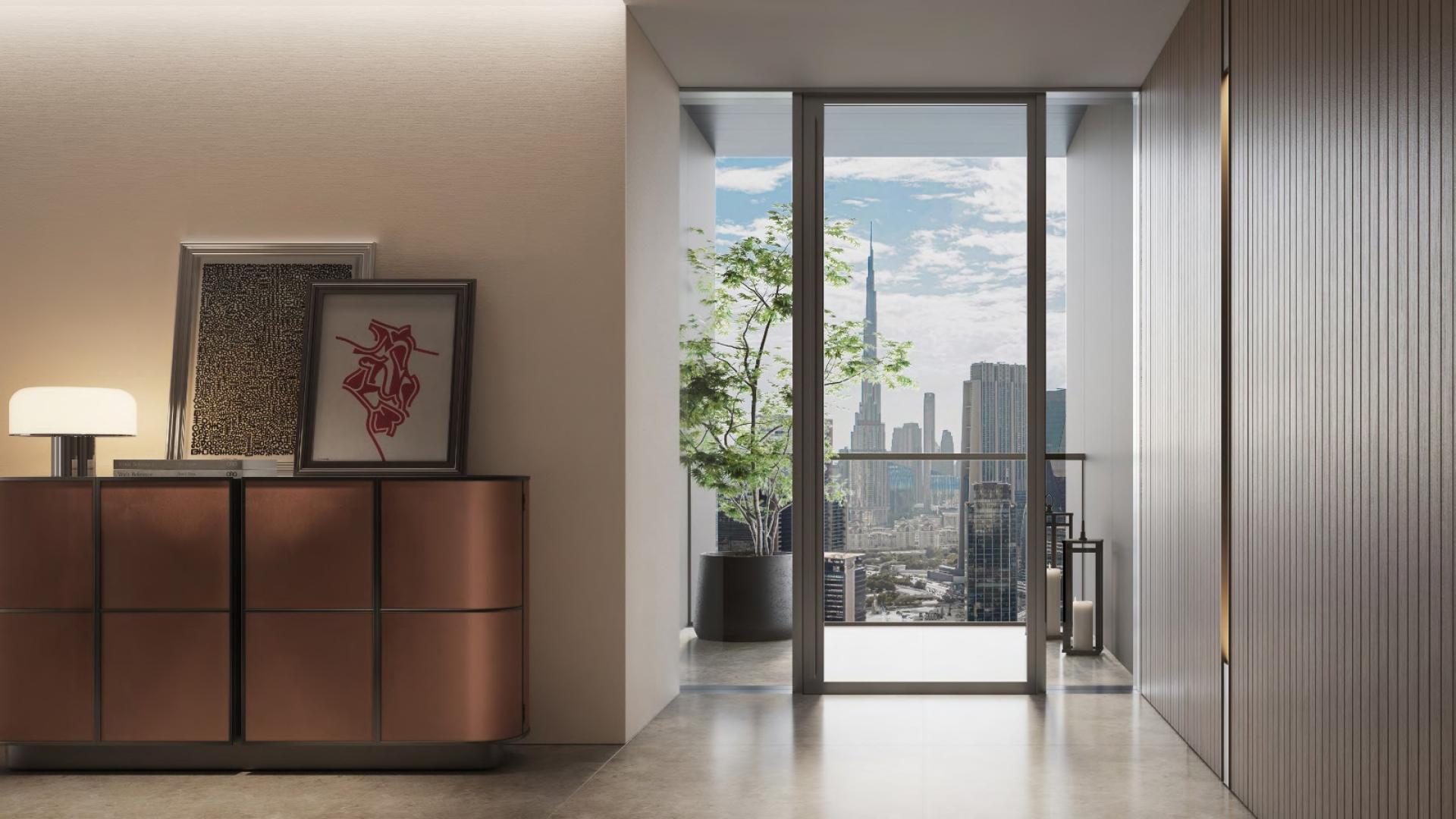 Modern apartment interior with city skyline view from balcony at Emirates Towers, Jumeriah Residences
