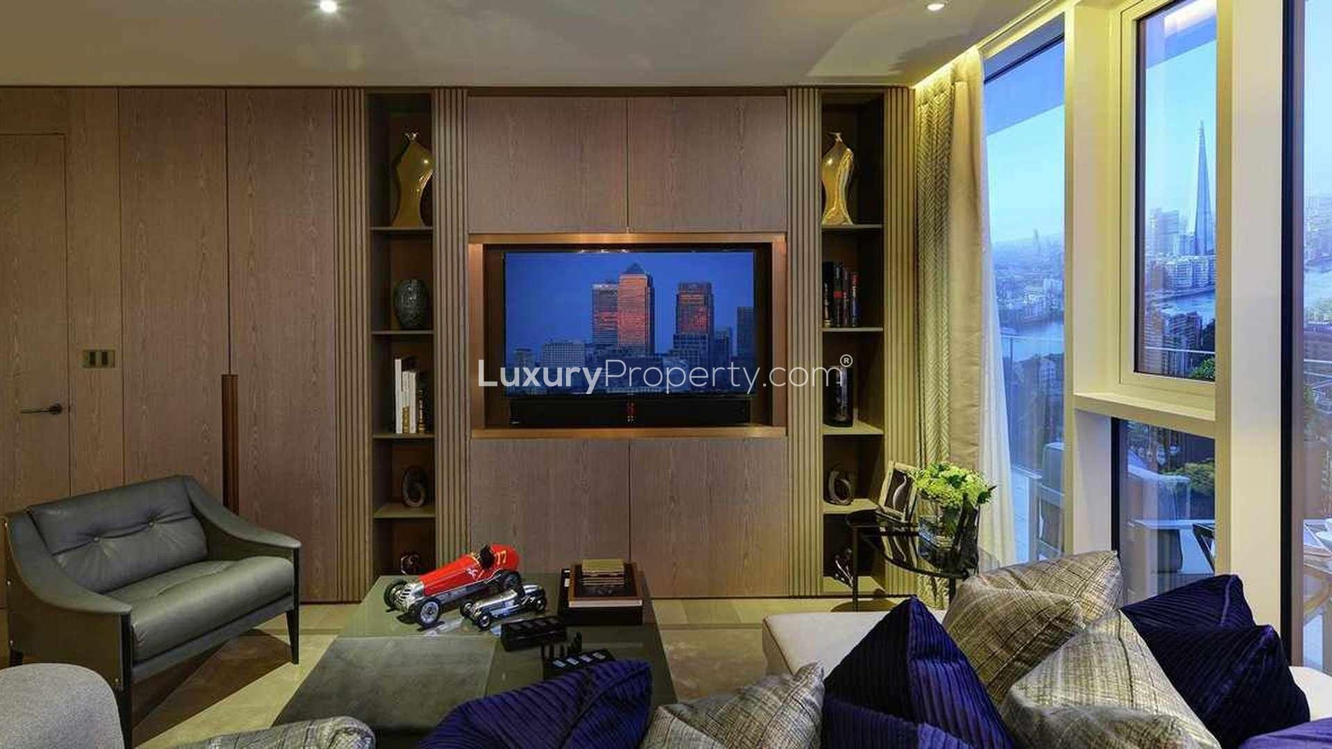 Luxurious living room in Clipper Wharf apartment, featuring modern decor and city views