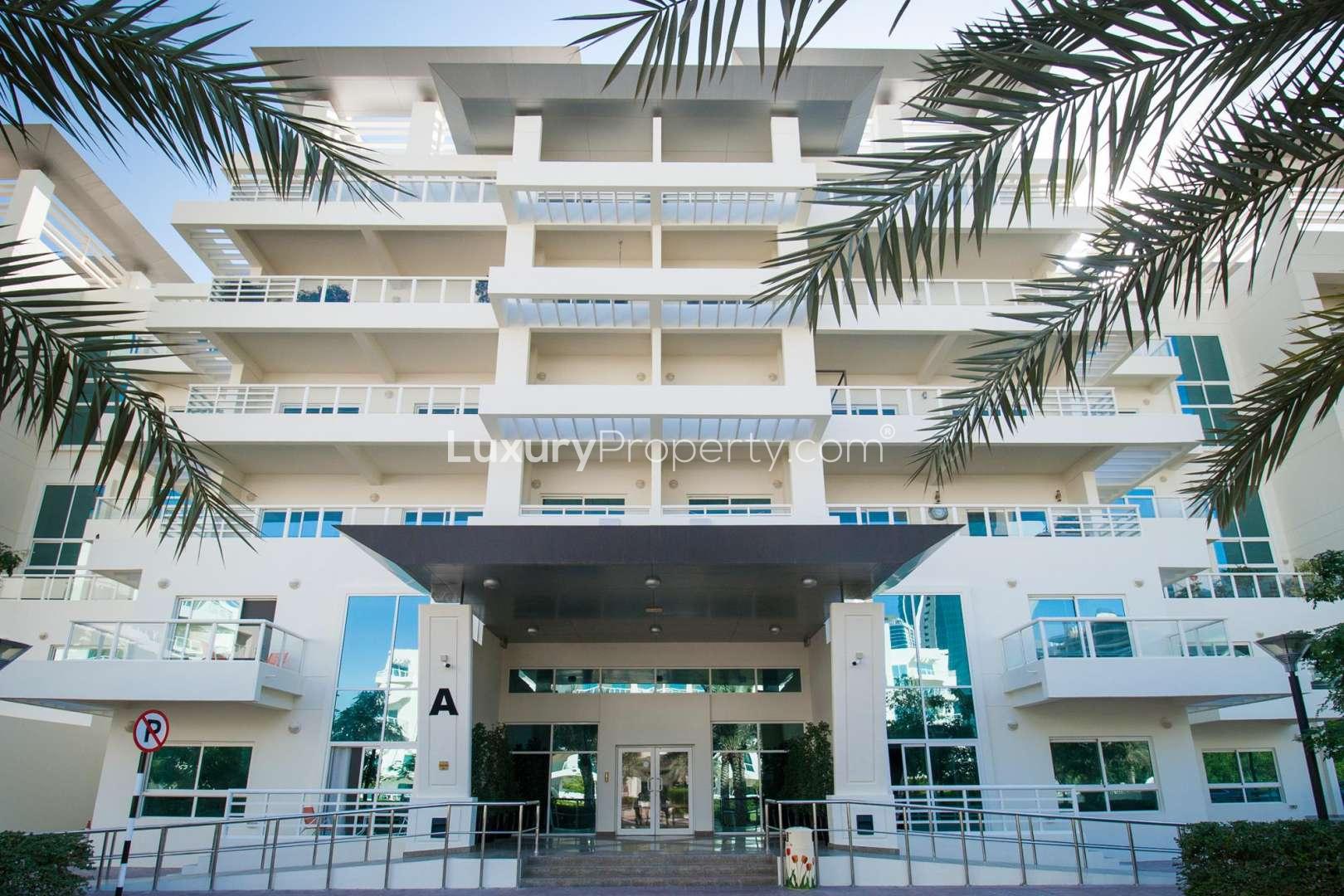 Exterior view of modern apartment building in Jumeirah Heights, Cluster D, for rent