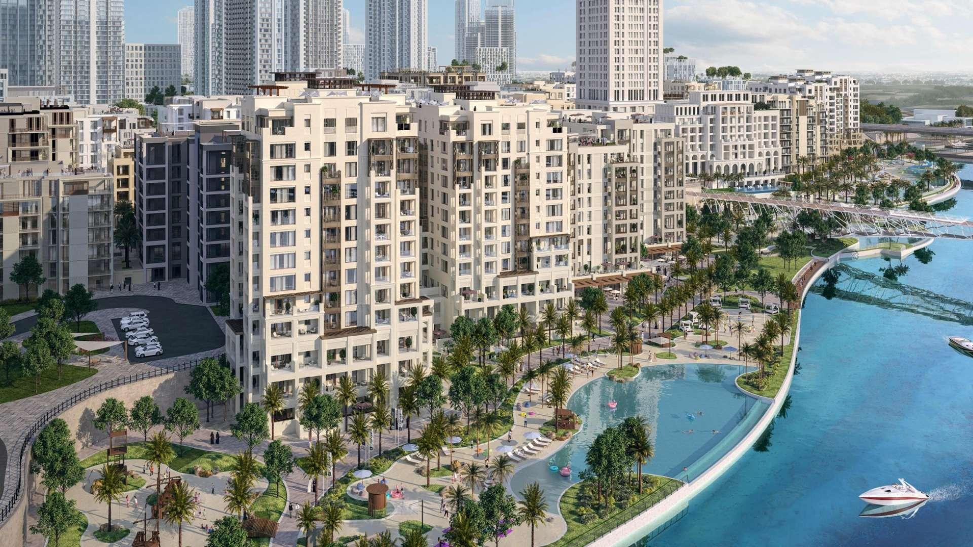 Modern open-plan kitchen and dining area in Orchid apartment, Dubai Creek Harbour