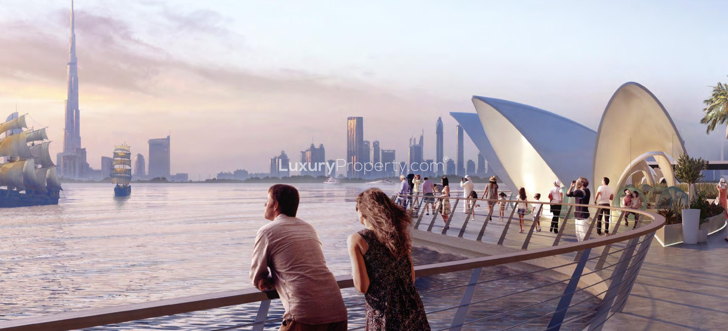 View of Dubai Creek Harbour skyline from Creek Gate boardwalk at sunset