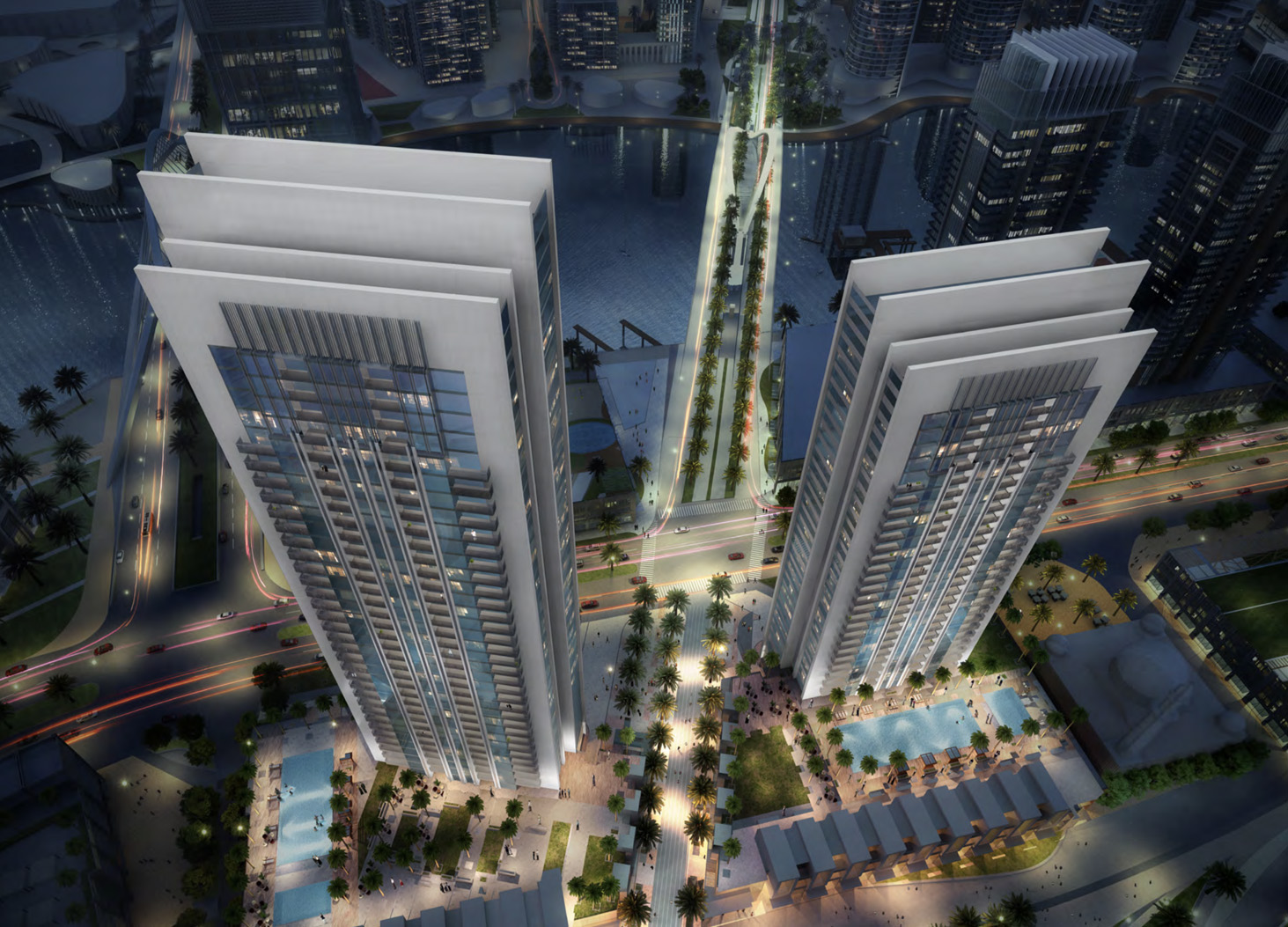 Aerial view of Creek Gate towers at night in Dubai Creek Harbour community