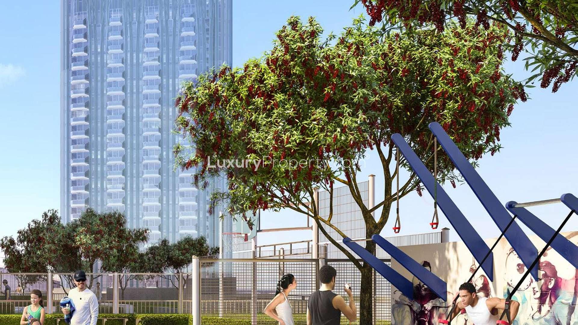 Modern Creek Rise apartment building with outdoor fitness area, Dubai Creek Harbour