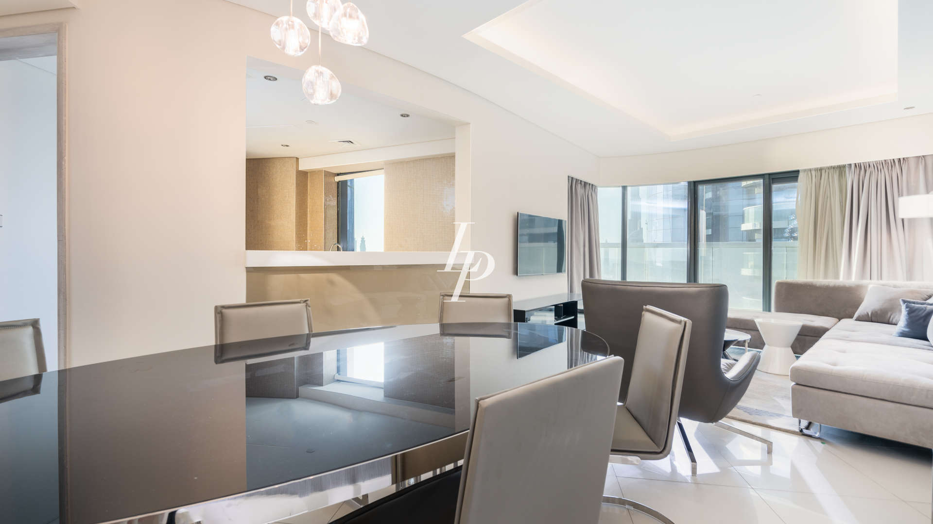 "Spacious bedroom in luxury Business Bay apartment with stunning sea views and modern decor.",Luxury 3-bedroom apartment interior with modern dining and living area in Business Bay