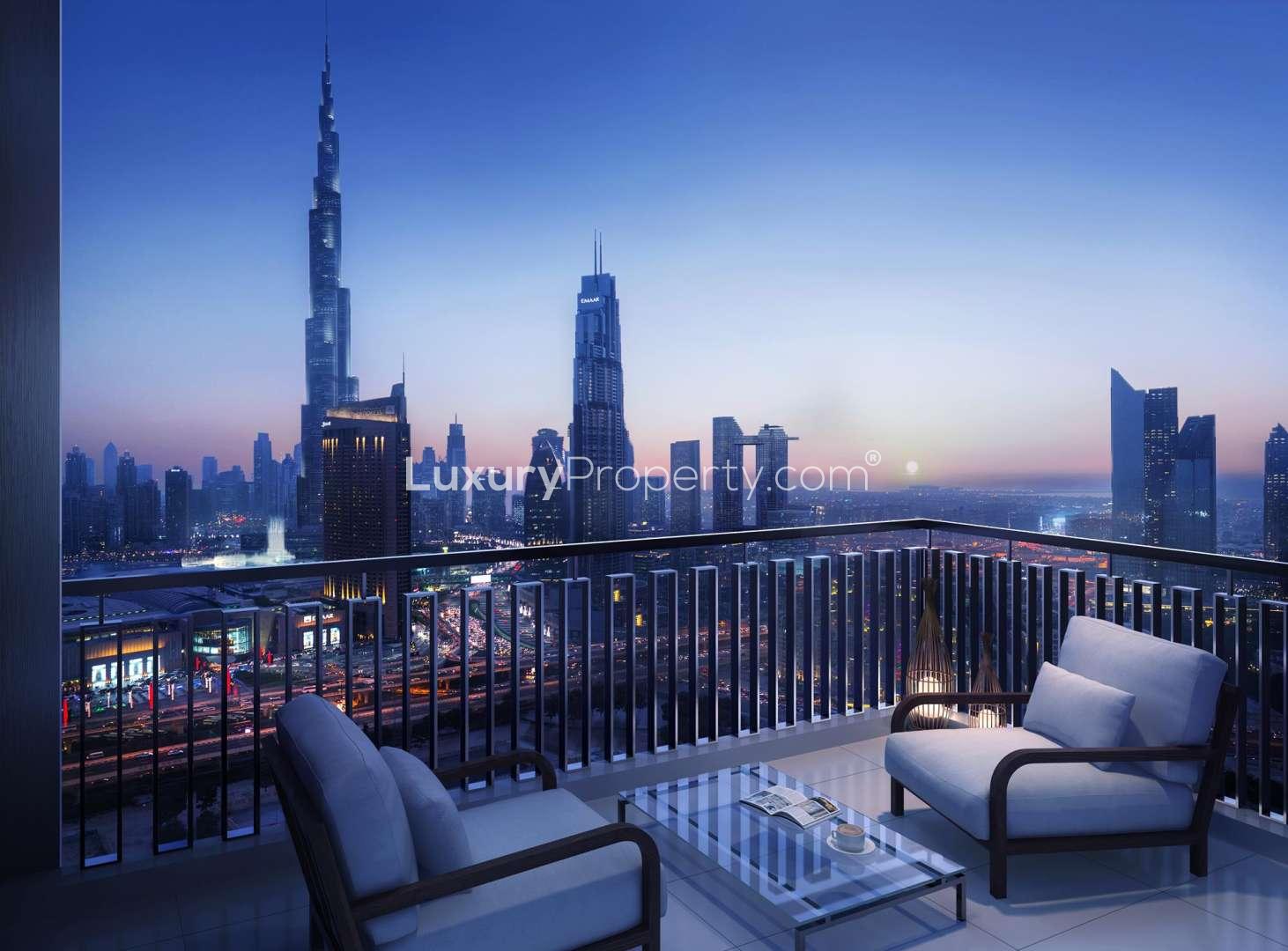 Spacious Downtown Dubai apartment bedroom with city skyline view, elegant decor, and balcony access