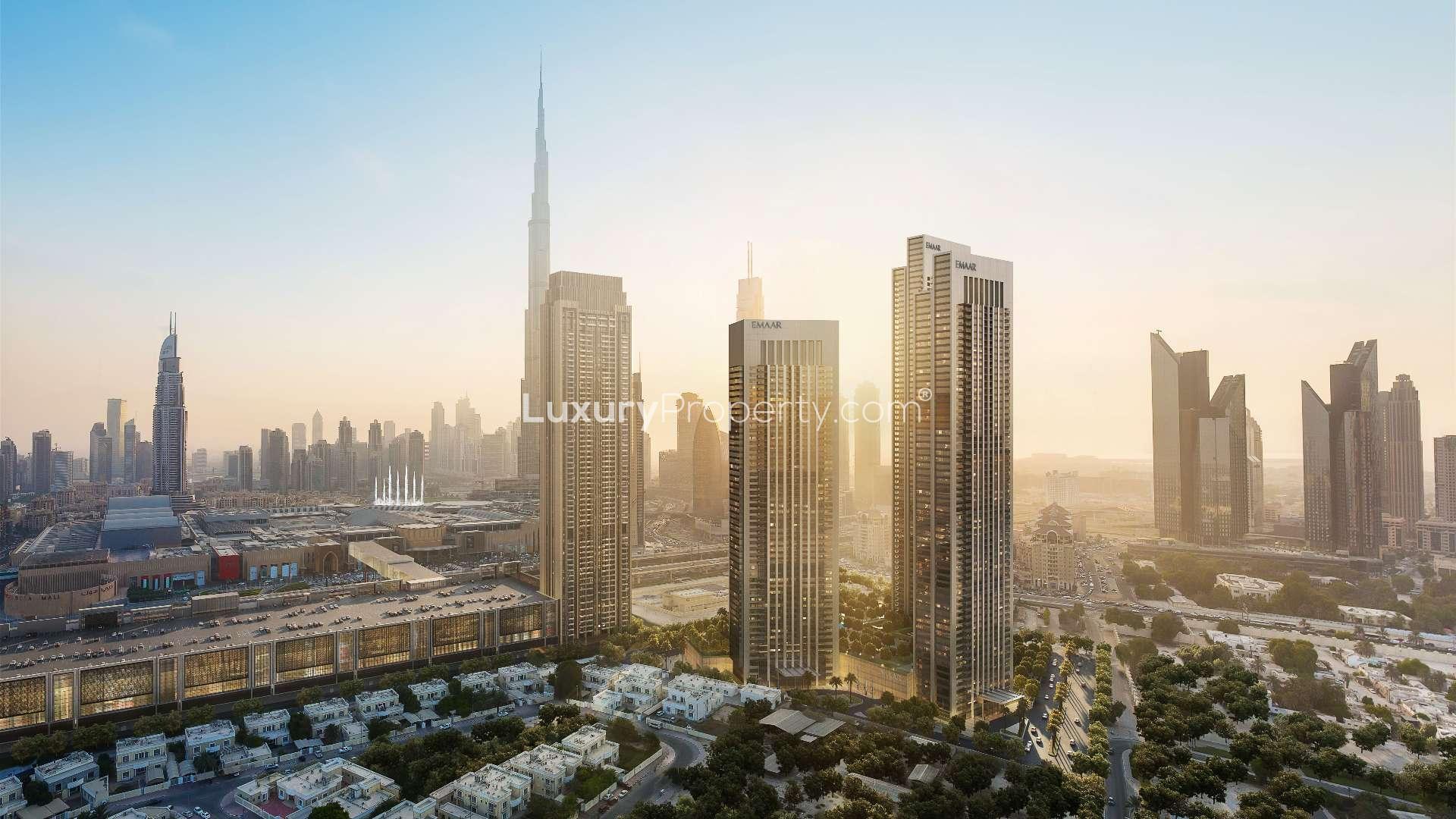 "Stunning view from Downtown Dubai apartment overlooking Burj Khalifa and city skyline at sunset.",Modern kitchen in 3-bedroom Downtown Dubai apartment with Burj Khalifa views, for sale