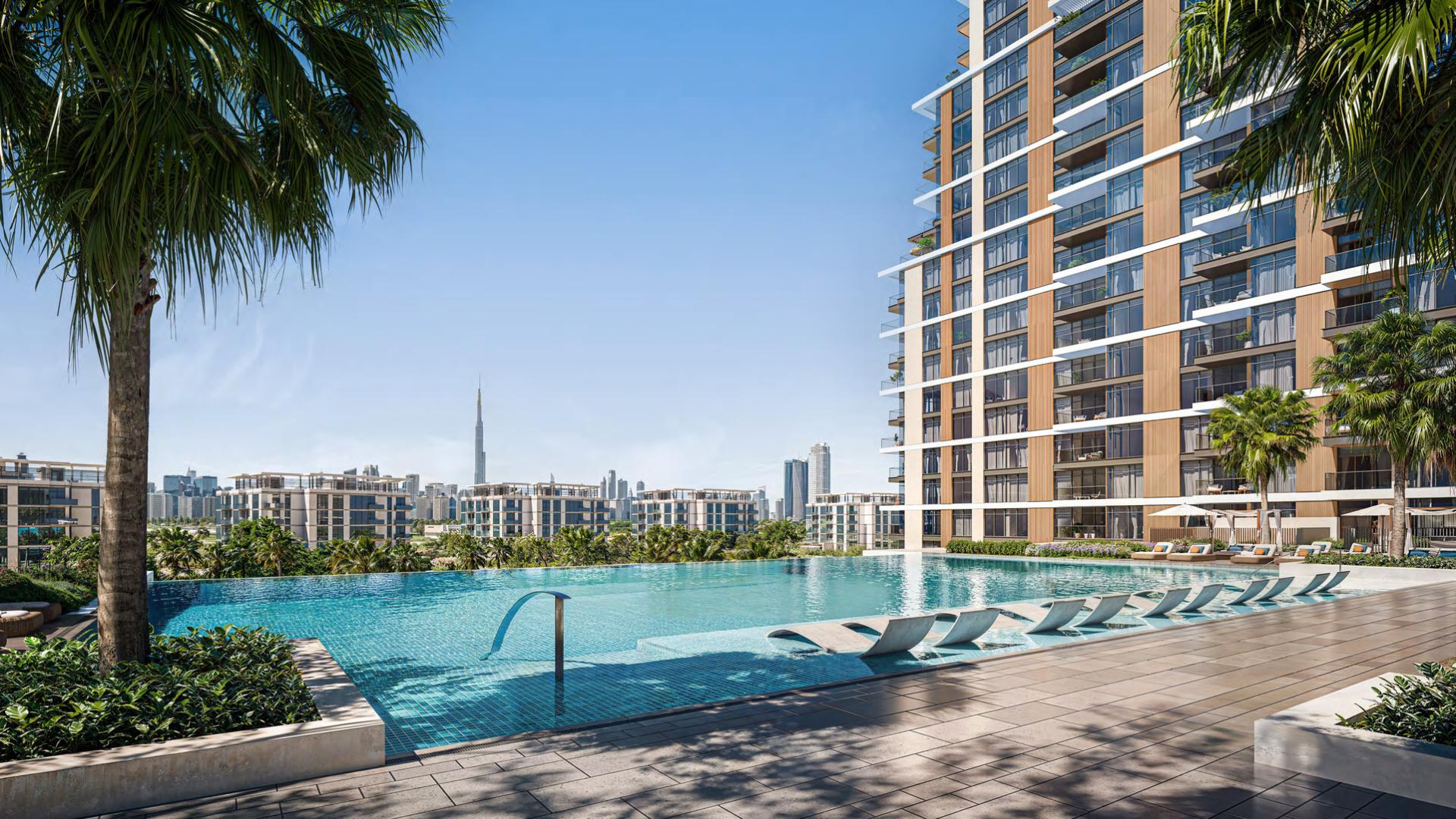 Luxurious living room in 3-bedroom apartment, District One, with city skyline views