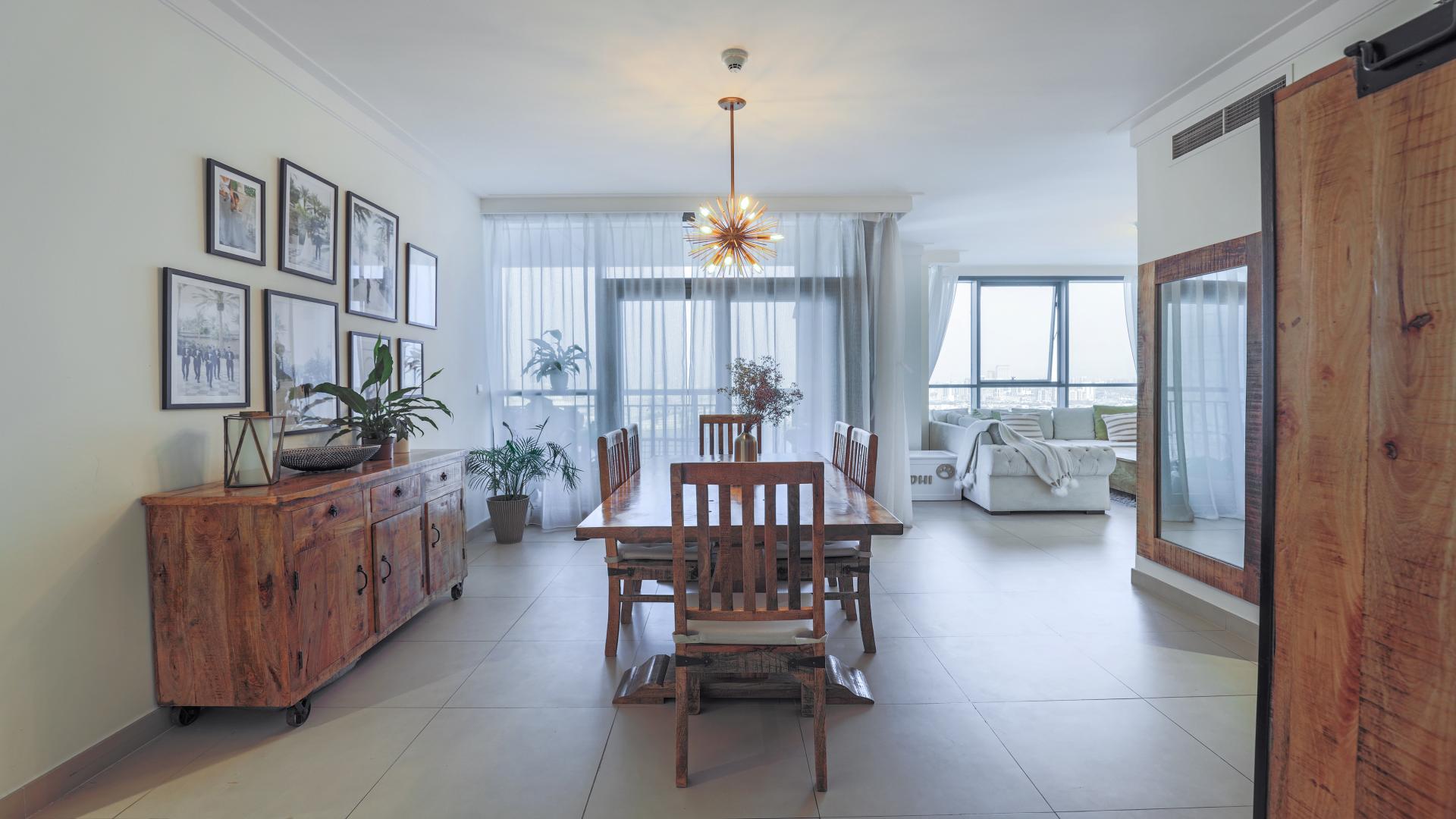 Dining area in 3-bedroom apartment, Dubai Creek Harbour, with modern decor and natural light