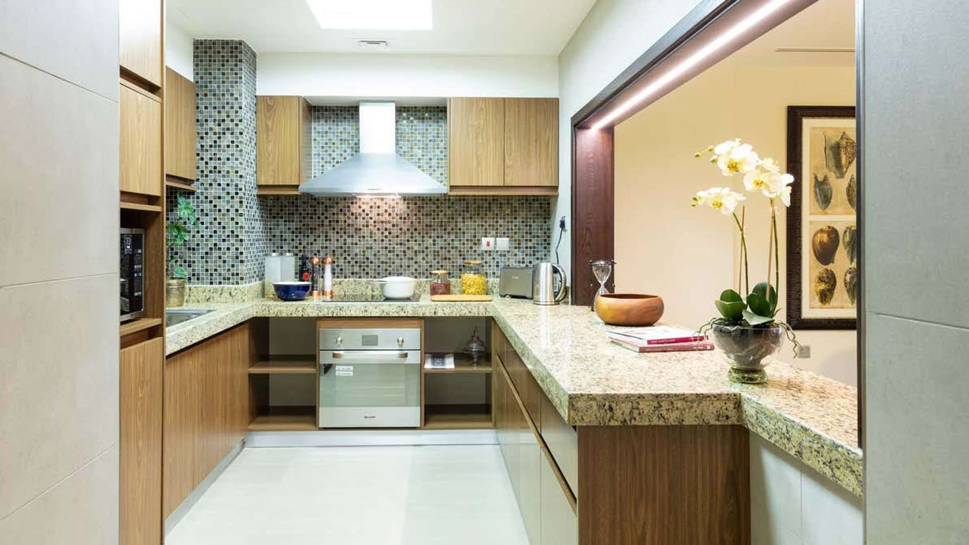 Modern living and dining area in Dubai Wharf apartment, featuring elegant decor and natural light