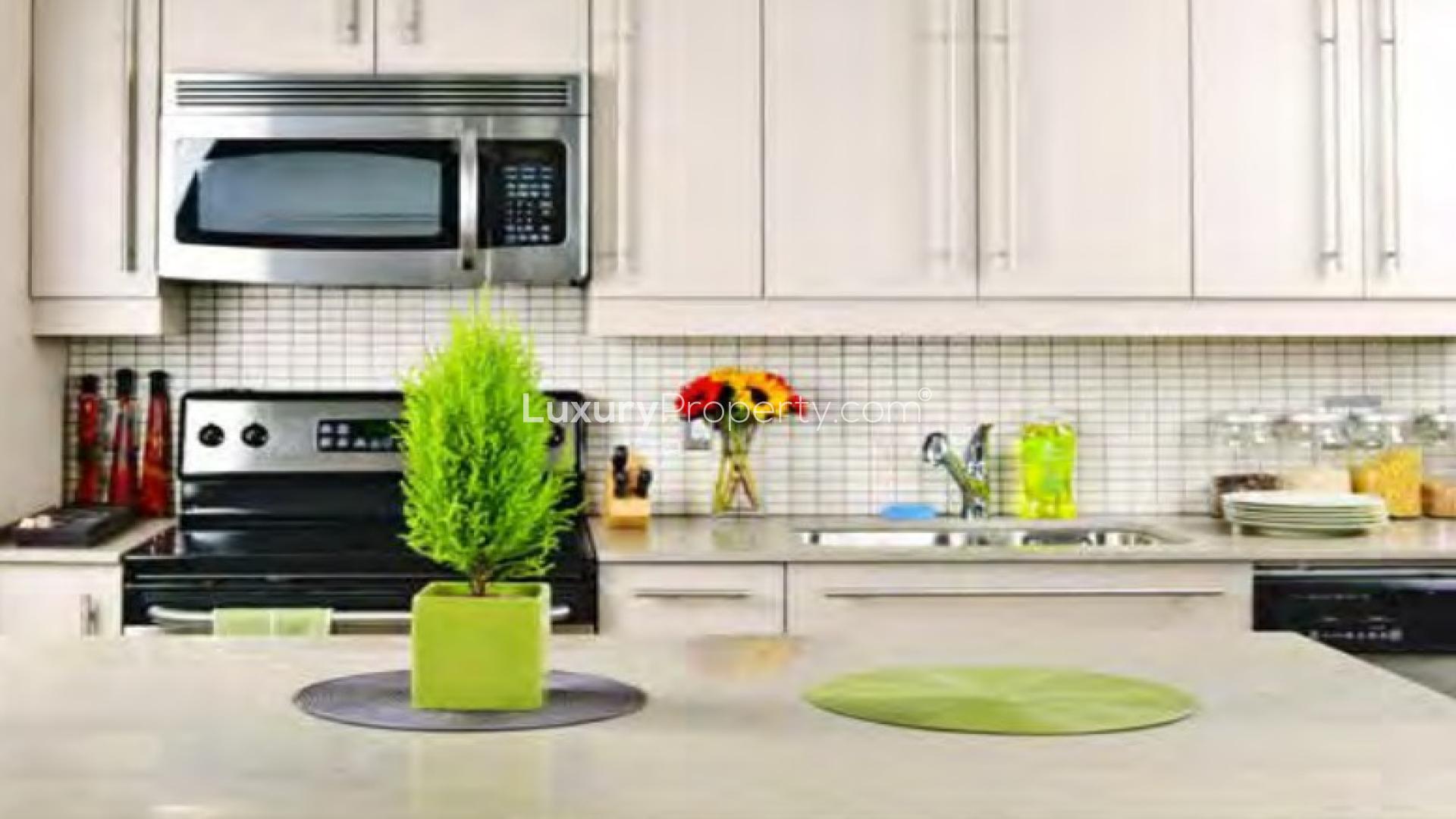 Modern living room and dining area in Queen Sheba apartment, Living Legends community