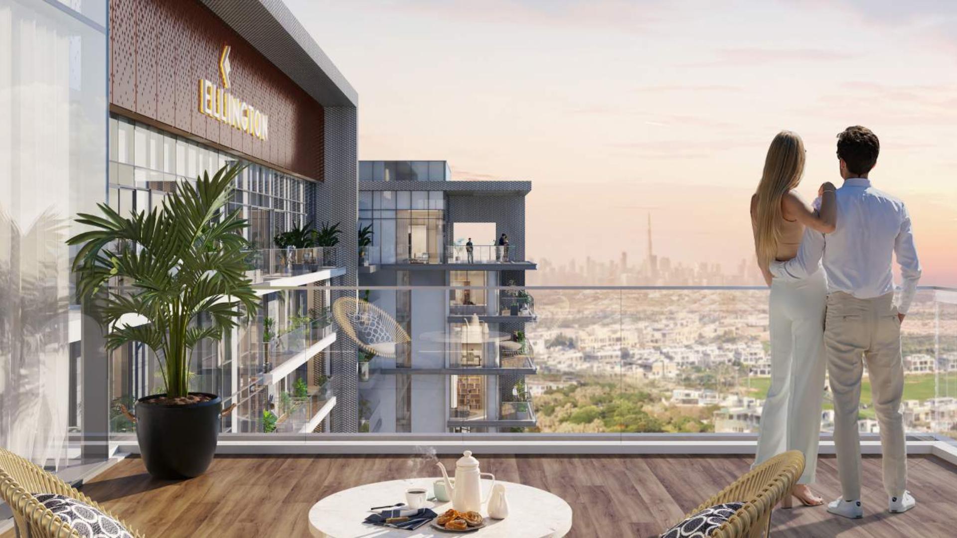 Couple enjoying city view from Ellington House apartment balcony, Dubai Hills Estate