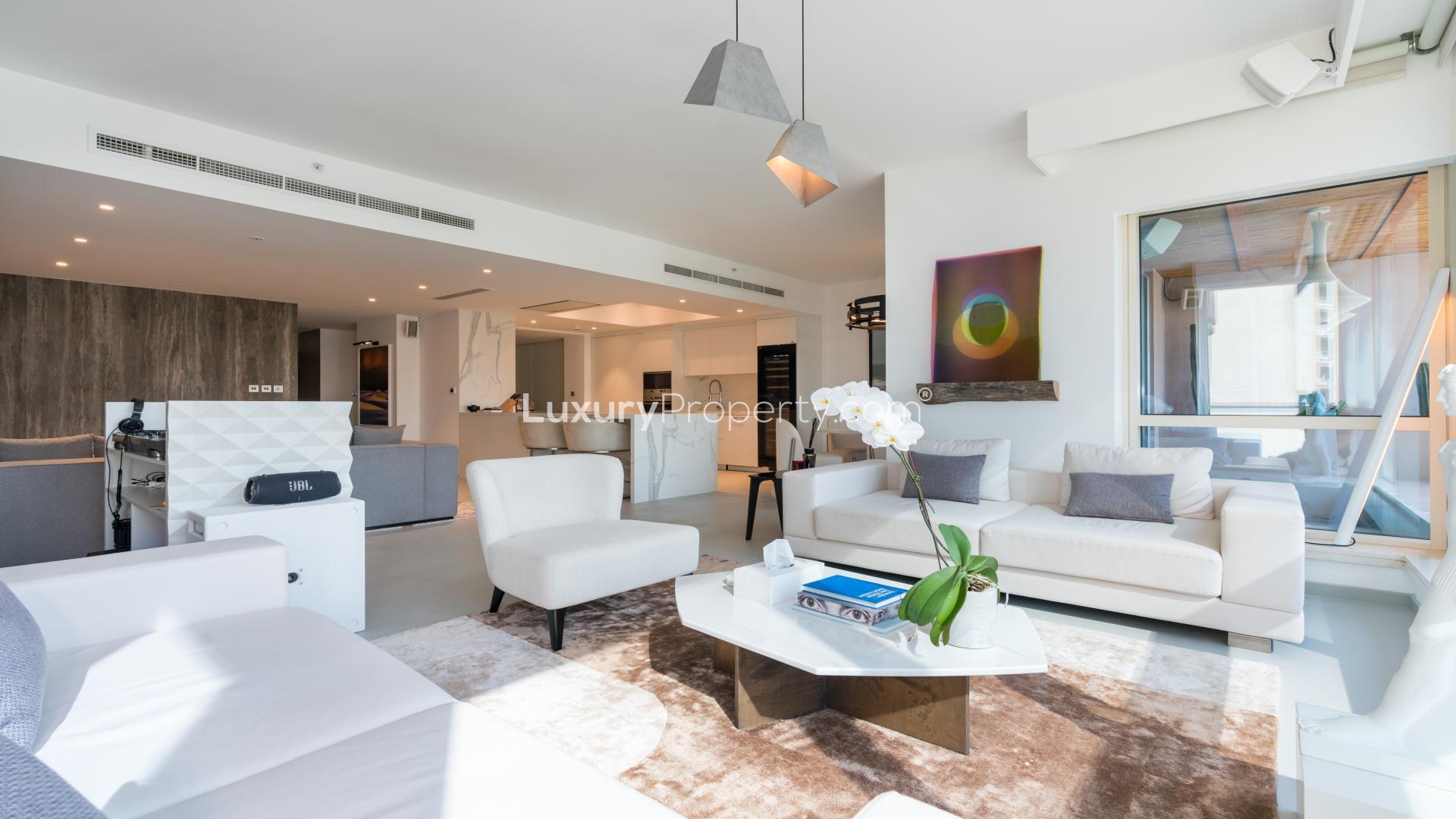 Sleek Dubai Marina apartment living room with modern decor and stunning skyline views
