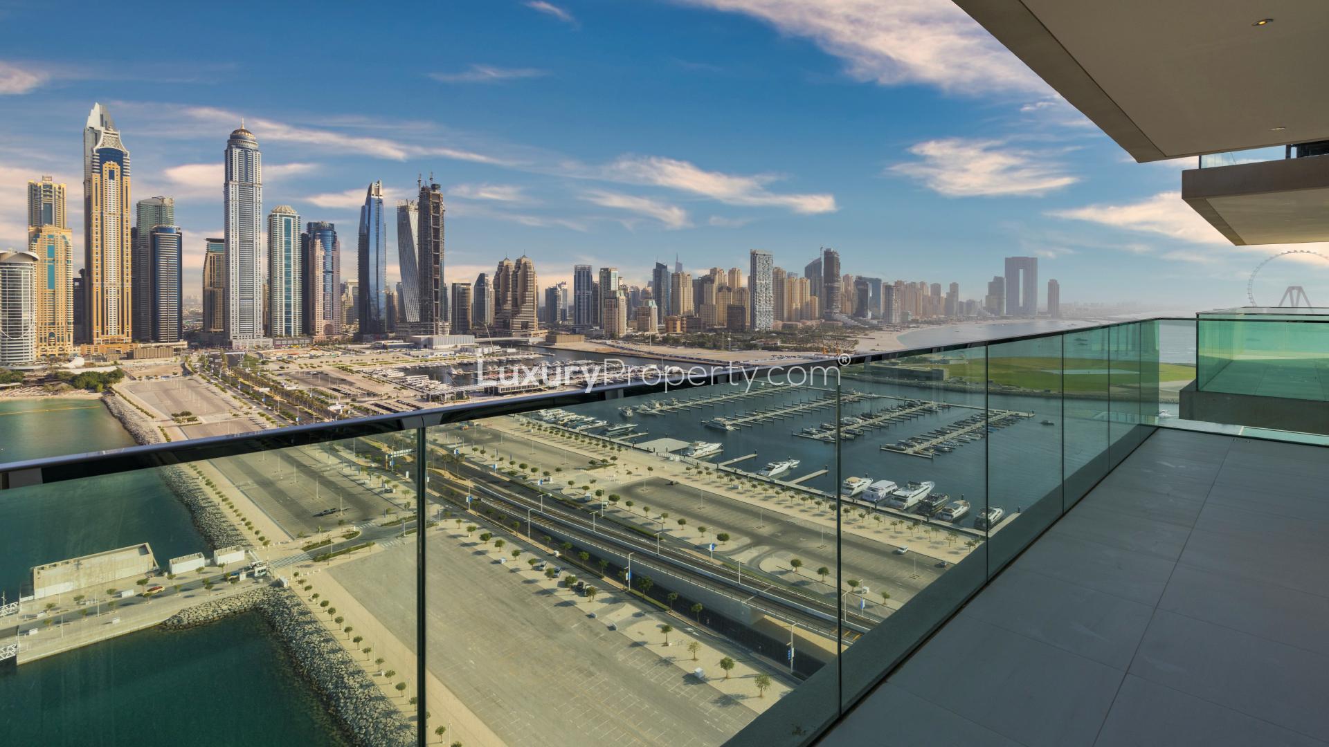 Empty room with large windows, panoramic Dubai skyline view, Emaar Beachfront apartment for sale