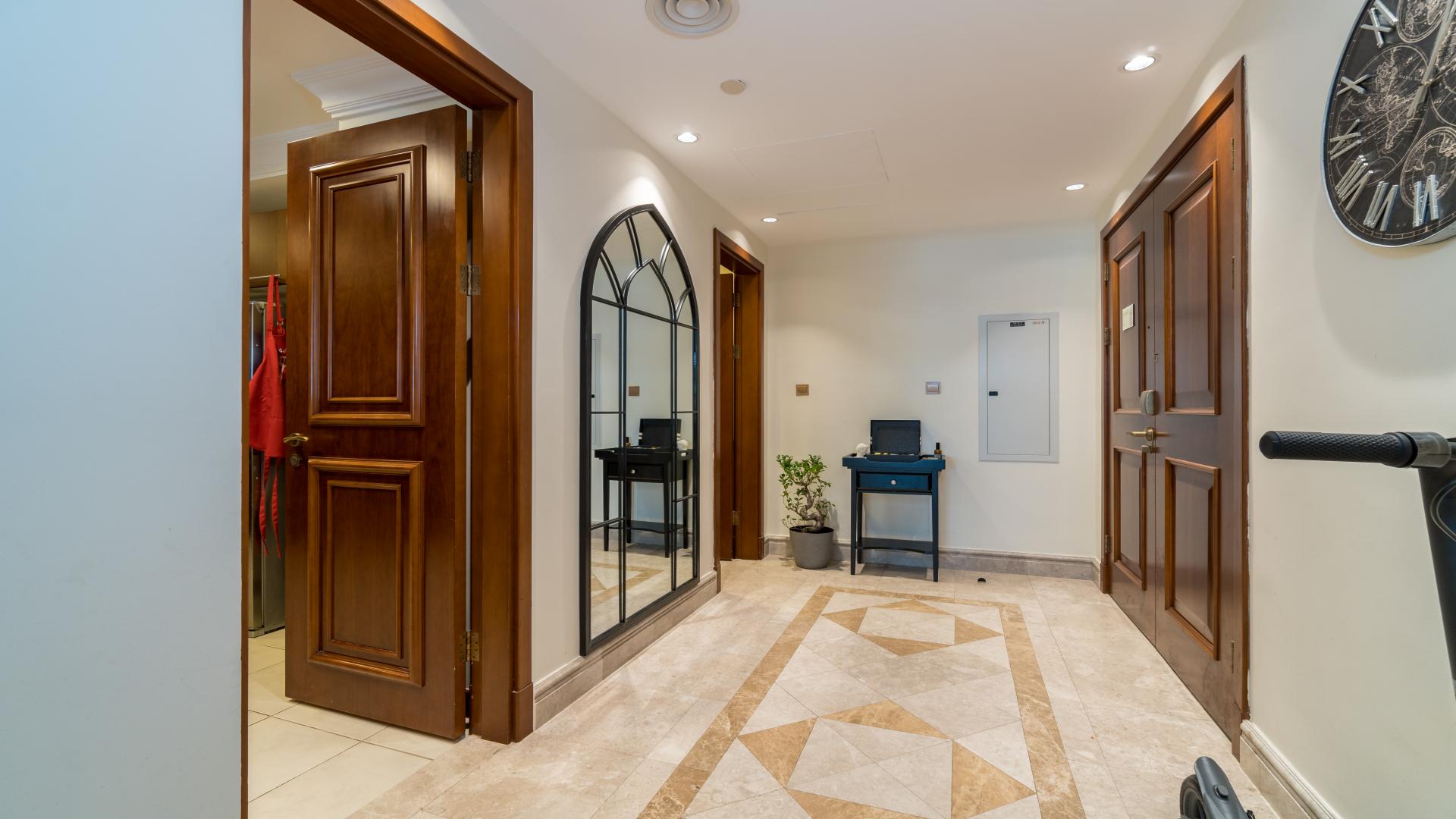 "Dining area in spacious apartment, Fairmont Residences, Palm Jumeirah, with modern decor and large window.",Entrance hallway of spacious apartment in Fairmont Residences, Palm Jumeirah for sale