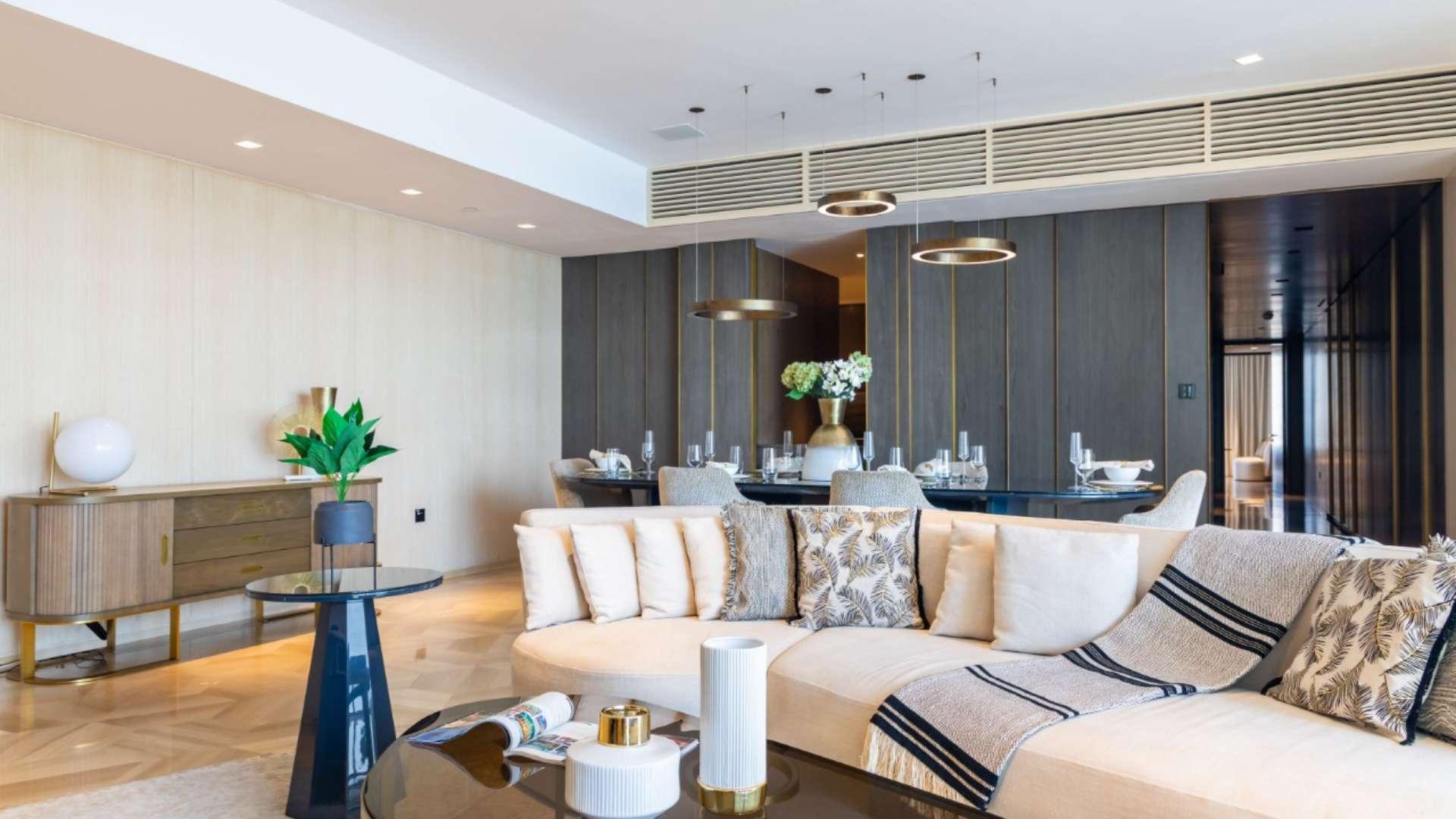 Luxurious dining and living area in Palm Jumeirah apartment with sea view and modern decor
