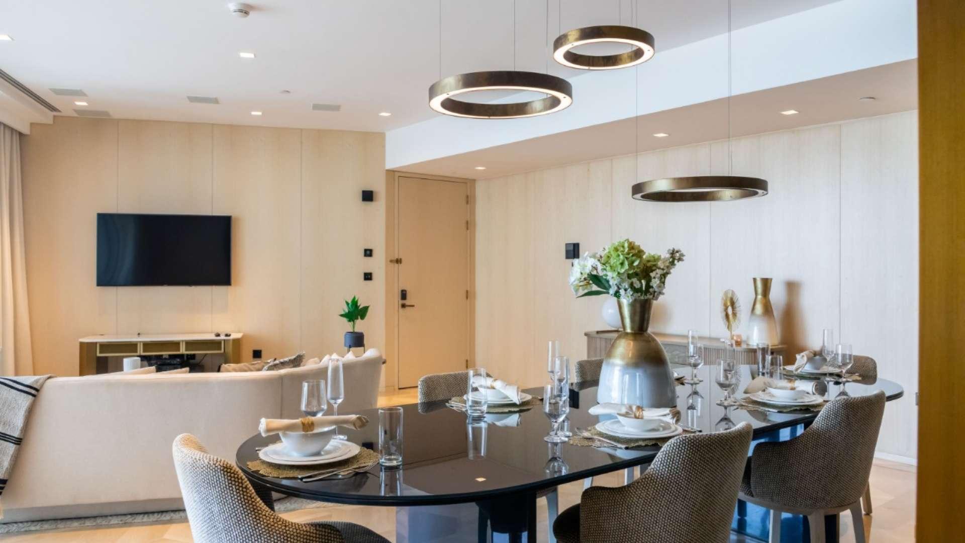 Luxurious living room in fully furnished Palm Jumeirah apartment for sale, modern decor