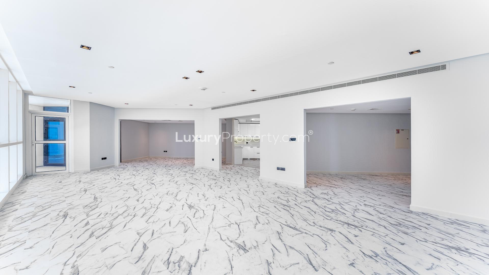 High-floor apartment view, Dubai Marina skyline, sea visible between skyscrapers, 23 Marina location