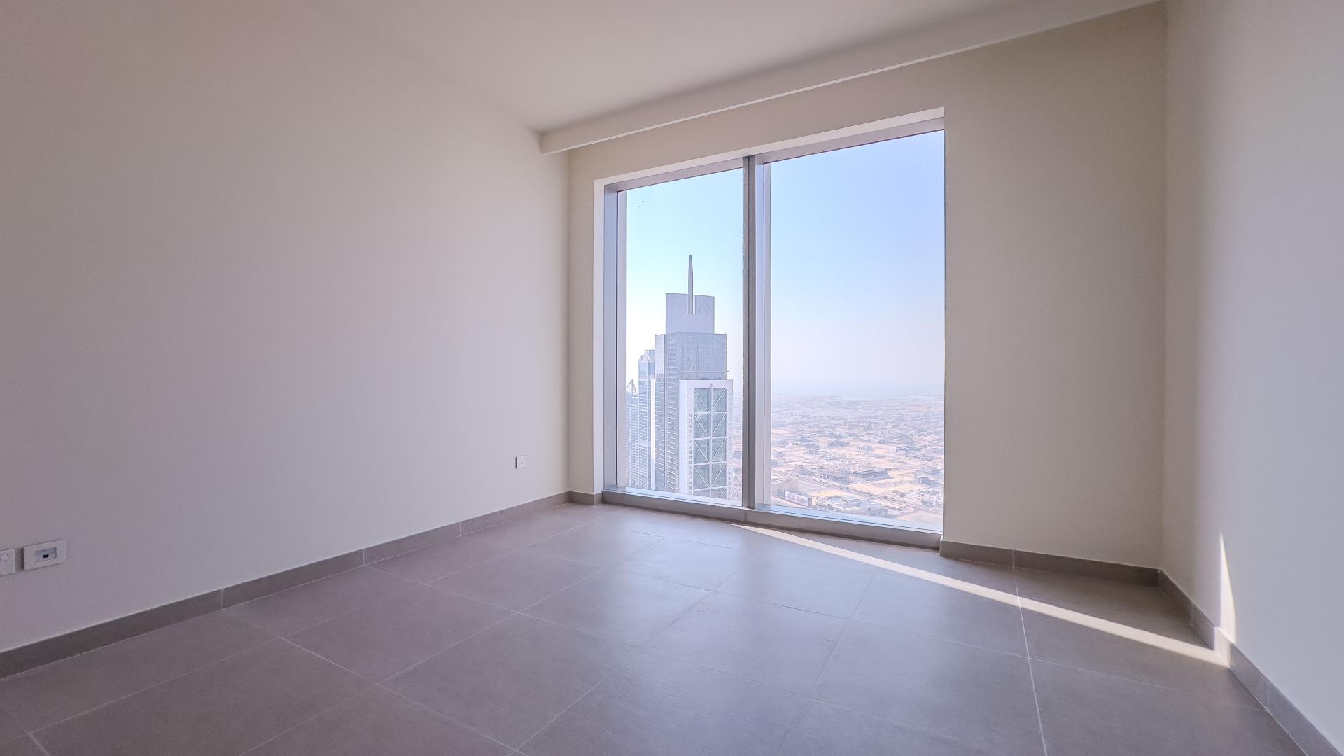 Modern kitchen and living area in Forte apartment, Downtown Dubai, with large windows