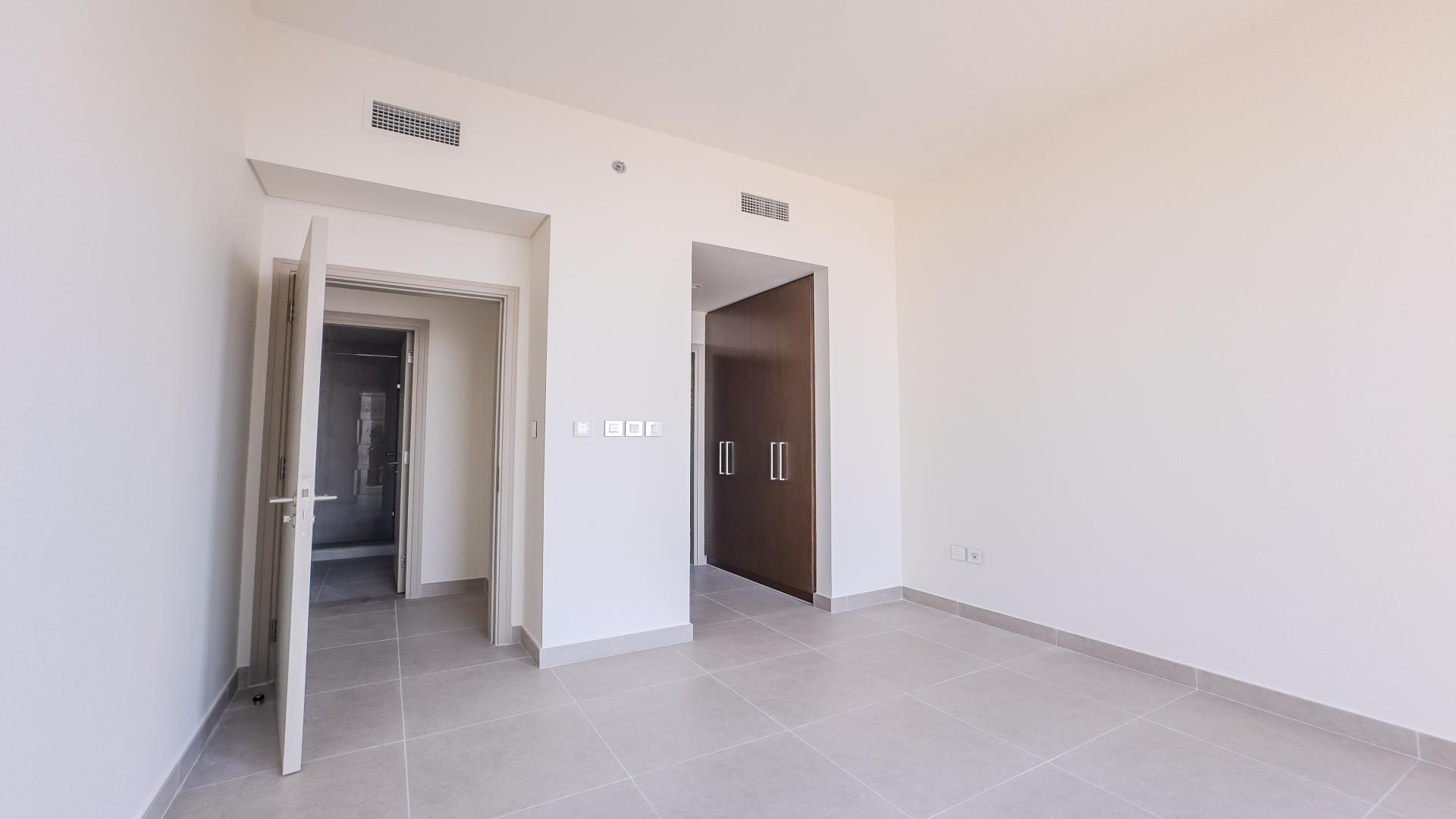Empty bedroom with large window view in Forte, Downtown Dubai apartment for sale