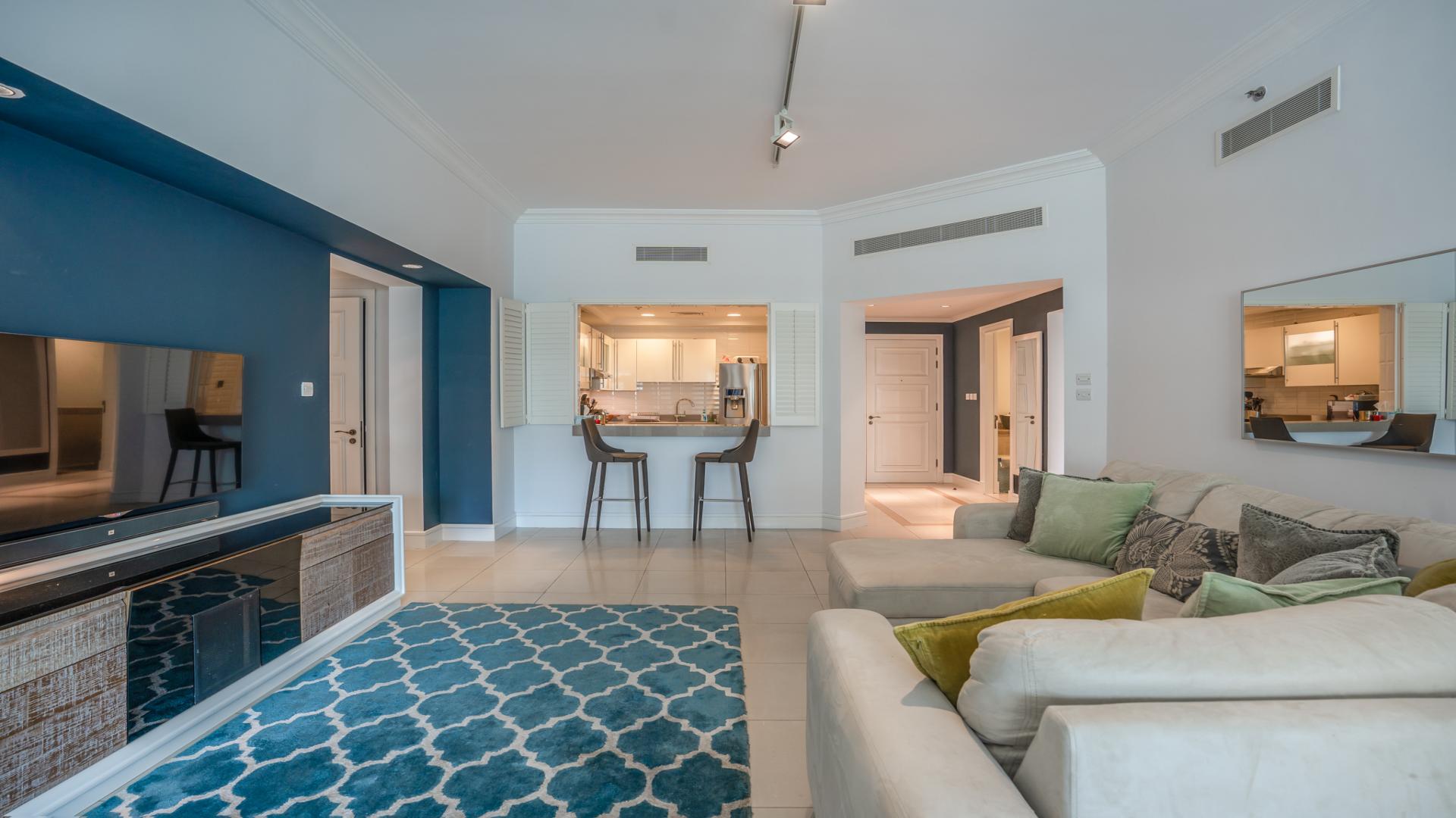 "Spacious balcony view from upgraded 3-bed apartment in Golden Mile, Palm Jumeirah, for sale.","Modern living room in upgraded 3-bed apartment, Golden Mile, Palm Jumeirah, for sale.",Modern kitchen in upgraded 3-bedroom apartment, Golden Mile, Palm Jumeirah, for sale