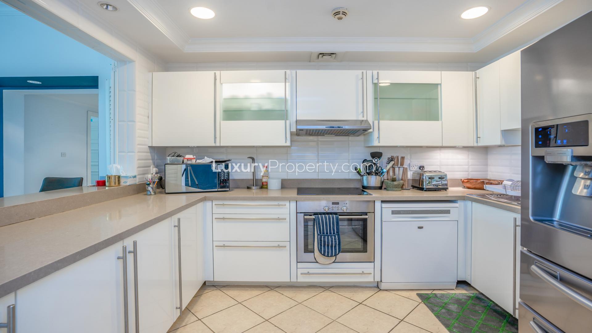 Upgraded apartment hallway and living area in Golden Mile, Palm Jumeirah, for sale