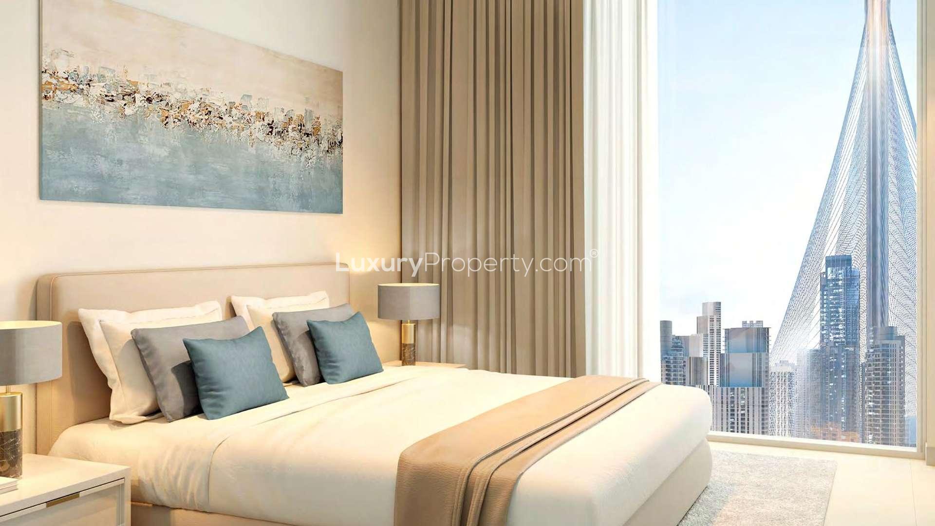 "Luxury apartment towers at Harbour Gate, Dubai Creek Harbour, surrounded by lush greenery and skyline.",Luxury bedroom with cityscape view in Harbour Gate, Dubai Creek Harbour apartment for sale
