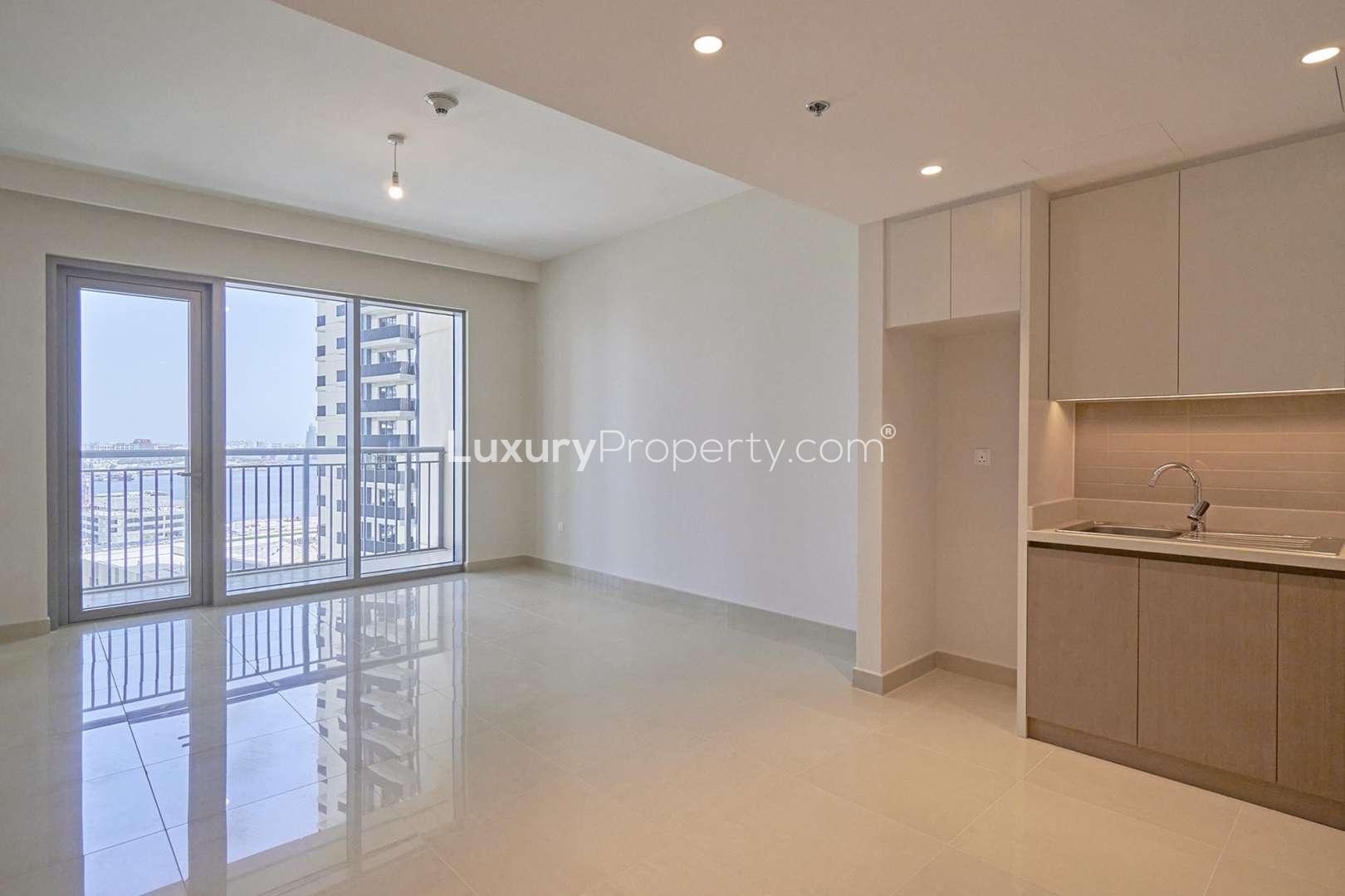 Luxurious pool area with skyline views at Harbour Views 1, Dubai Creek Harbour apartment