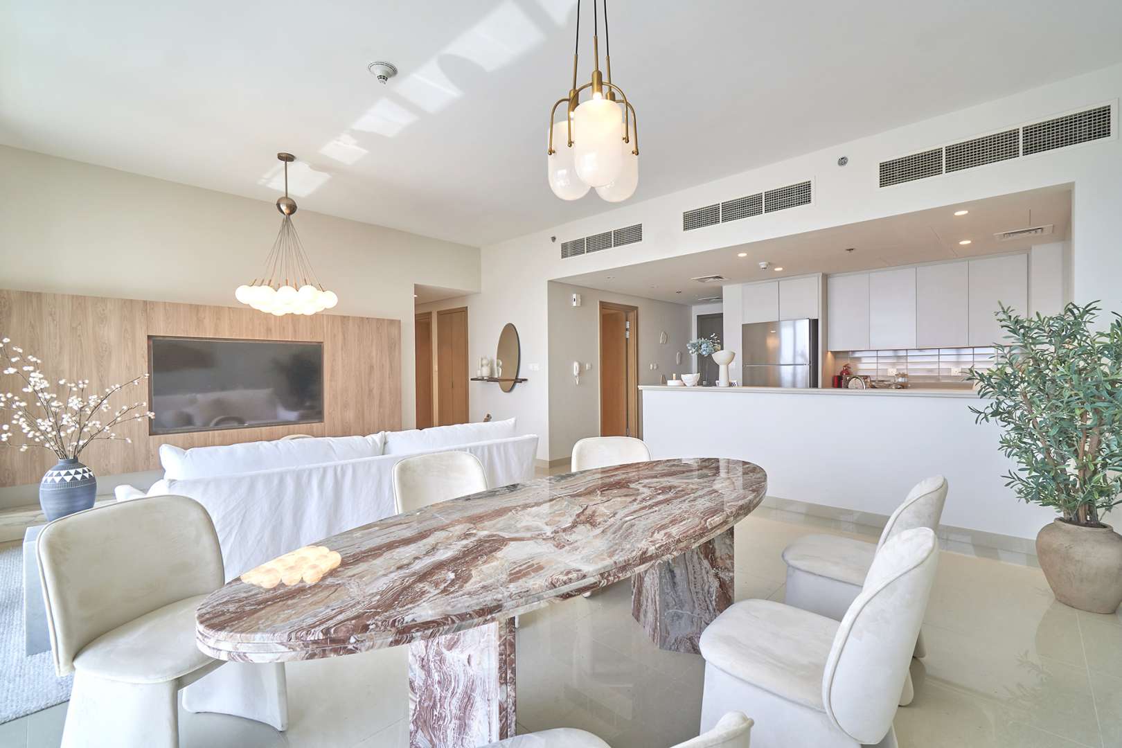 Modern dining and living area in three-bedroom apartment, Harbour Views, Dubai Creek Harbour