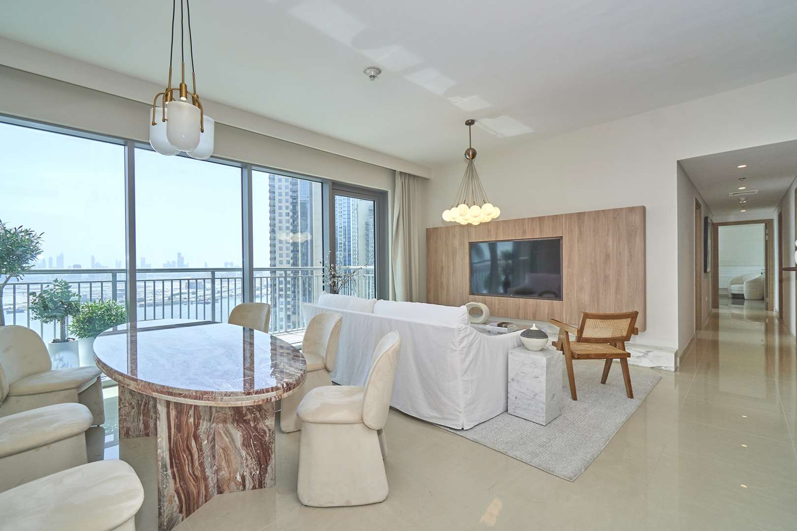 Modern living room in three-bedroom apartment, Harbour Views, Dubai Creek Harbour skyline view