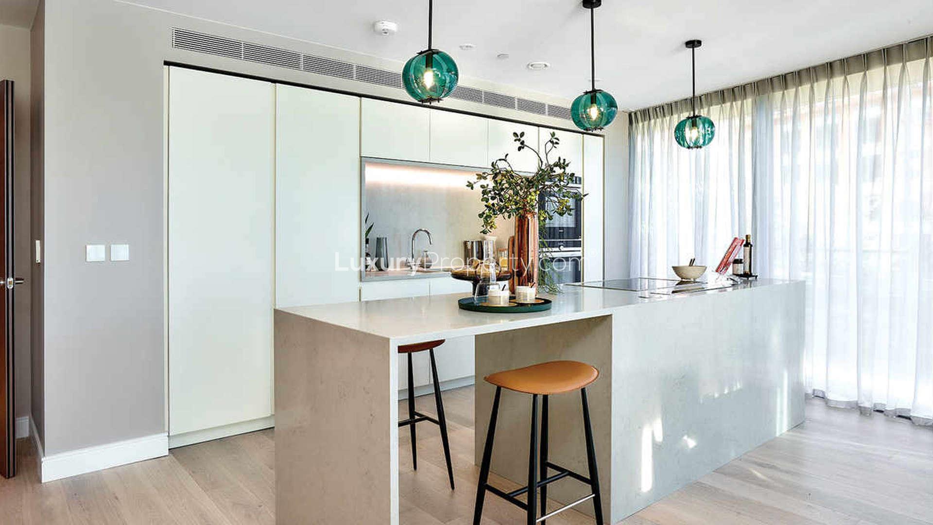 Modern open-plan kitchen and dining area in Hammersmith riverfront apartment, London