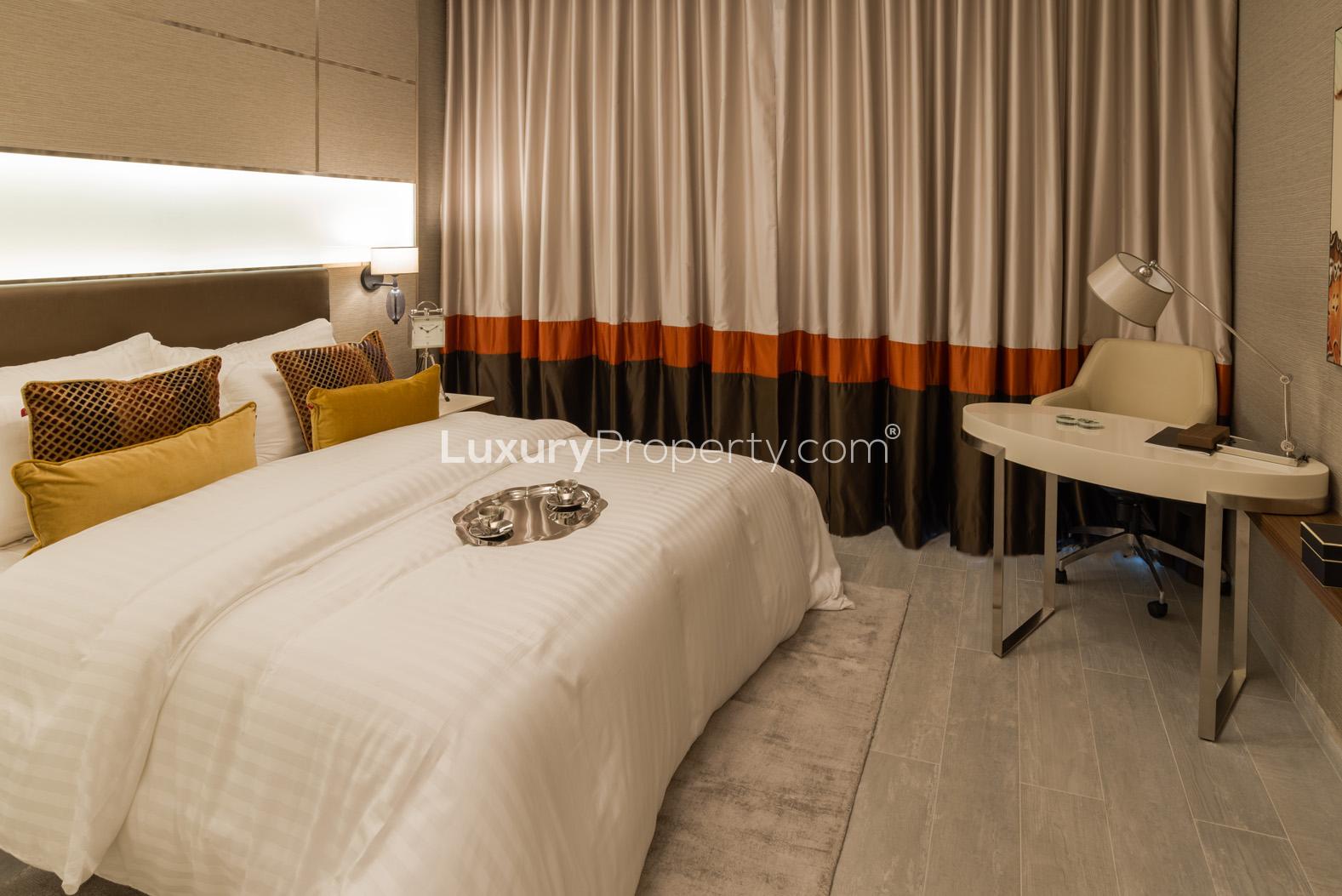 Elegant bathroom in 3-bedroom Downtown Dubai apartment, featuring modern fixtures and wooden accents