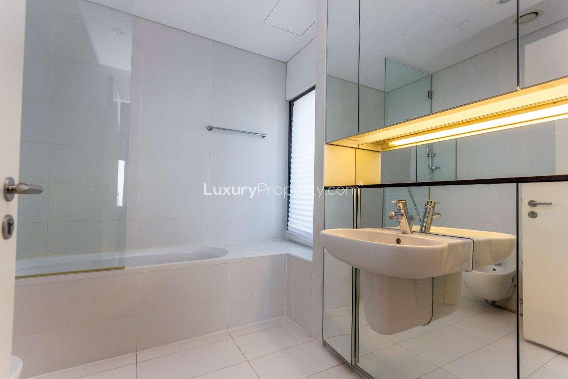 Modern bathroom in 3-bedroom apartment, Index Tower, DIFC, featuring sleek fixtures and spacious design