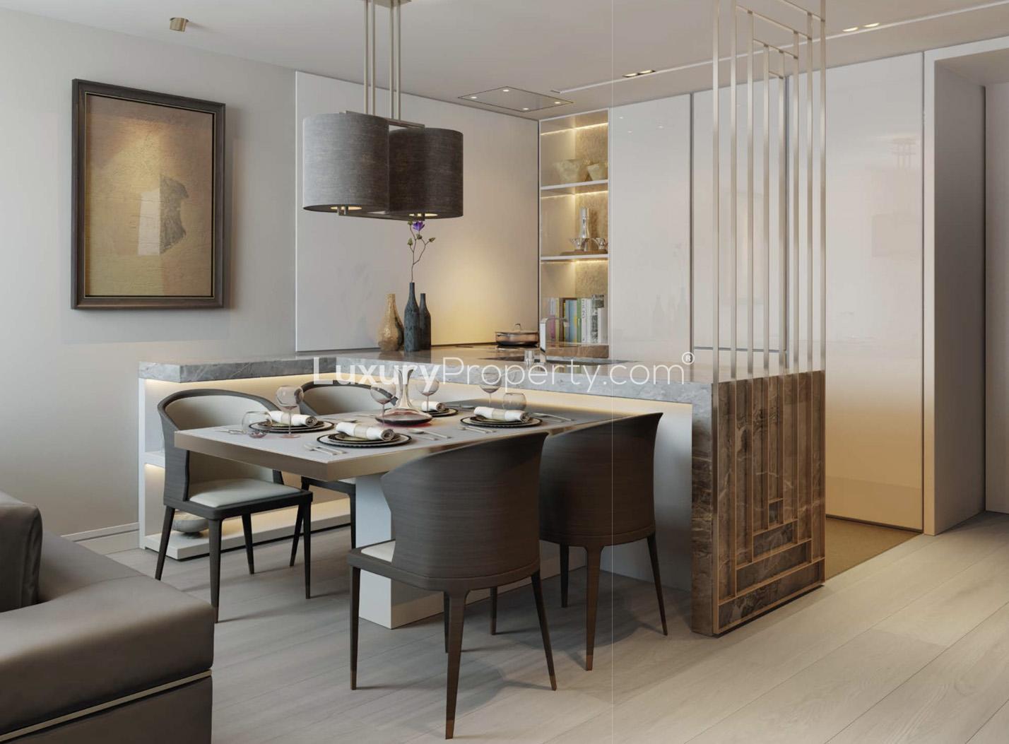 Modern living room in Lincoln Square apartment, London, with elegant furnishings and large window