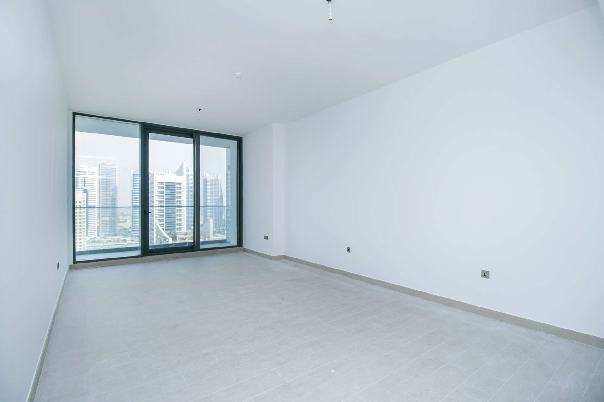 Spacious kitchen and living area with city view in Dubai Marina apartment for sale
