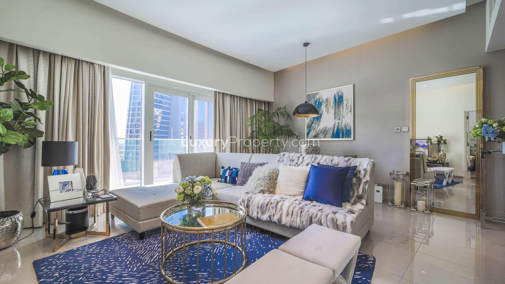 Luxurious living room in Maison Majestine apartment for sale, featuring elegant decor and seating