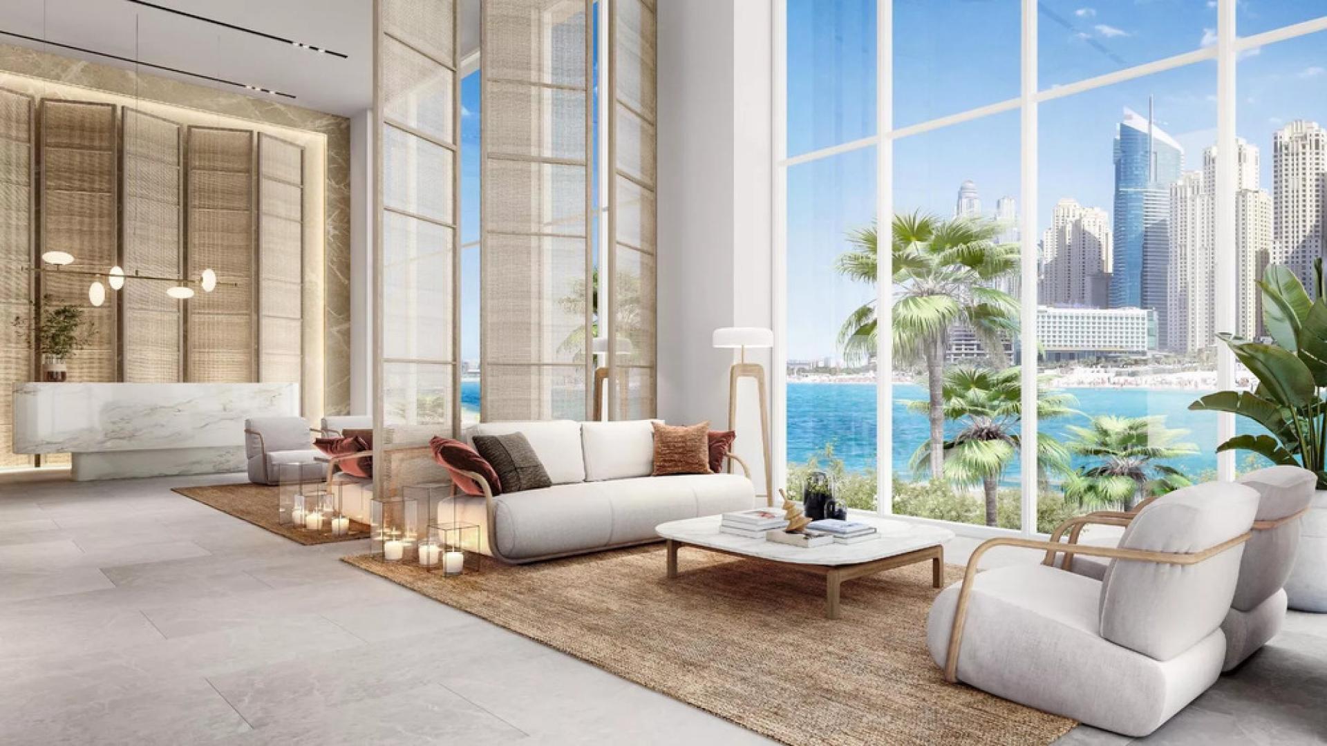 Sea view living room in Bluewaters Bay 3-bedroom apartment, modern decor and ocean backdrop