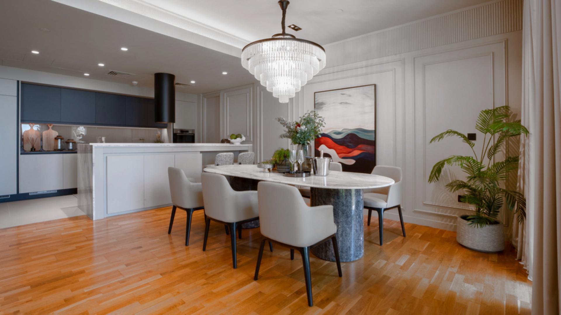 Dining area in upgraded 3-bedroom apartment, Bluewaters Residences, with sea and park views