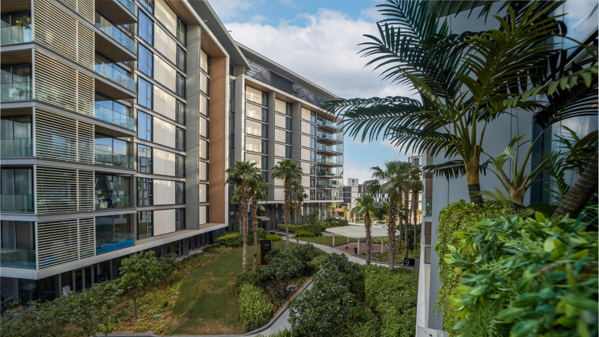 Luxurious living room in park-facing 3-bedroom apartment, Bluewaters Residences, modern decor