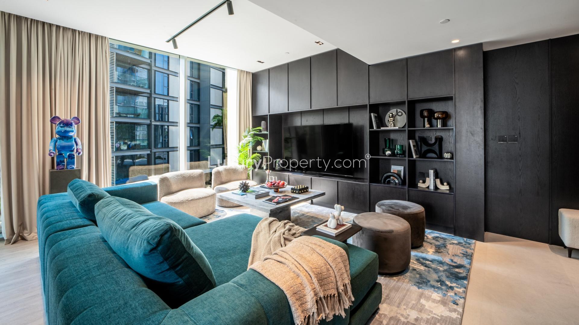 Park-facing view of Bluewaters Residences apartment building with lush greenery and modern architecture