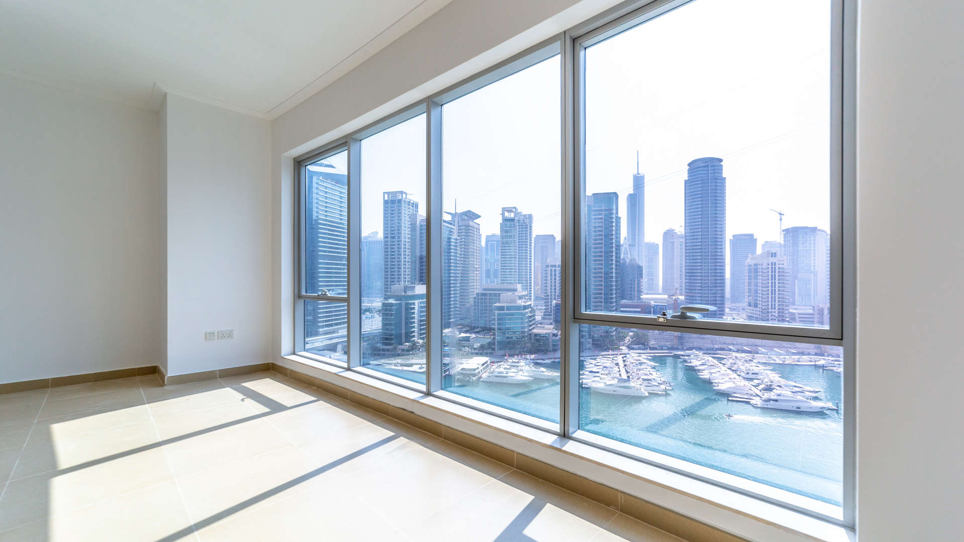 "Stunning Dubai Marina view from high-floor apartment in Paloma Tower for sale.",High-floor apartment view of Dubai Marina skyline from Paloma Tower, Marina Promenade