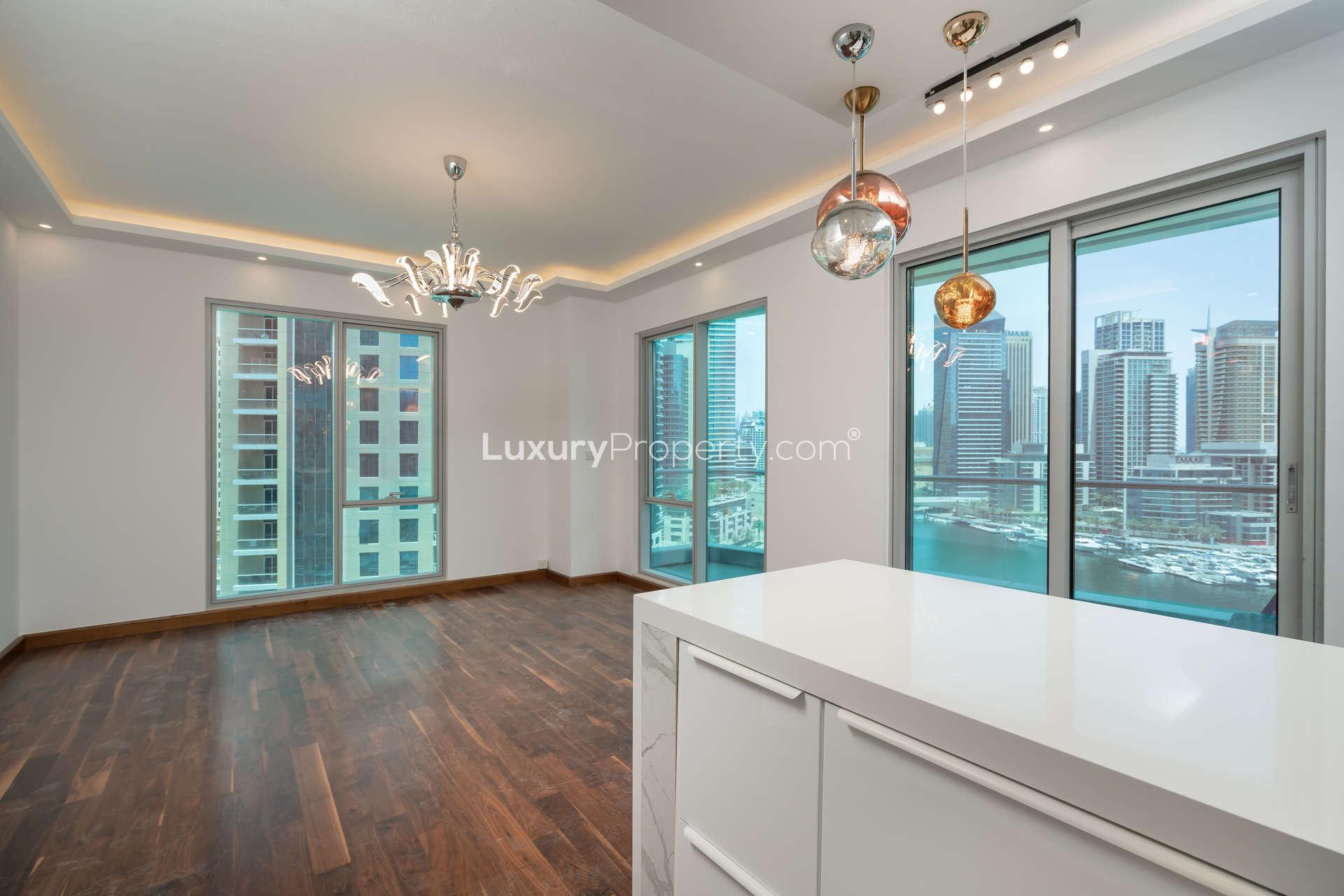Modern kitchen with stylish lighting and marina views in Delphine apartment, Dubai Marina