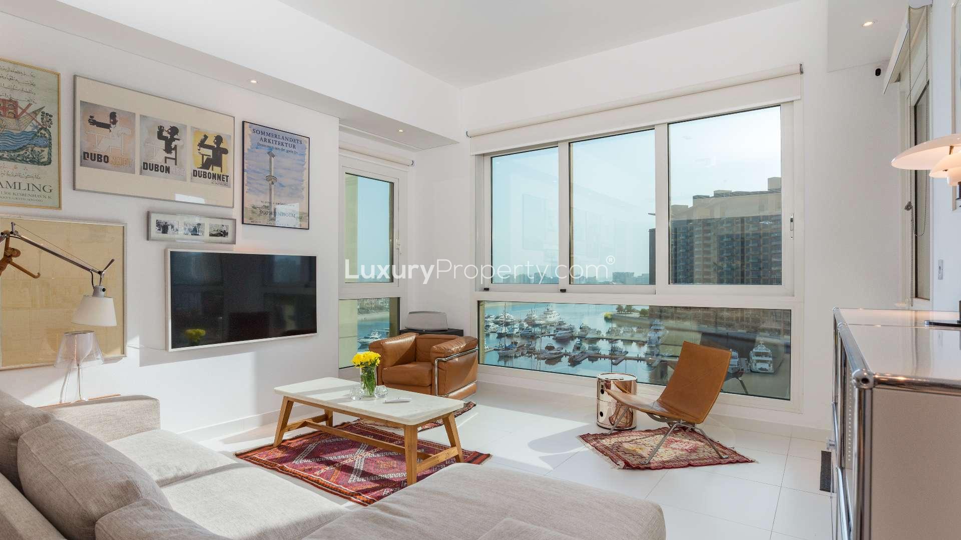 Bright living room in Palm Jumeirah apartment with sea view, modern decor, and large windows