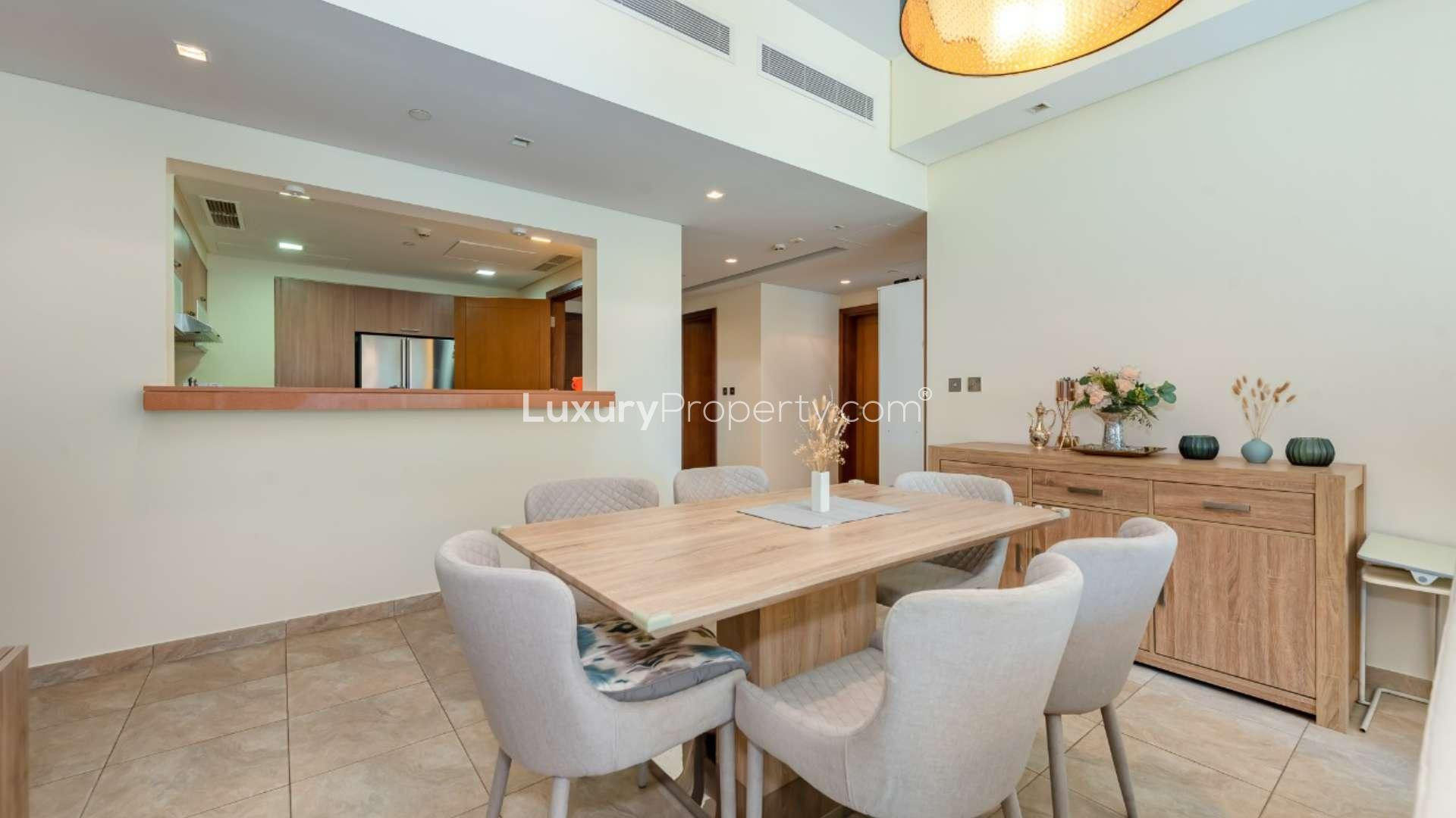 Dining and living area in Marina Residence apartment, Palm Jumeirah, with modern decor