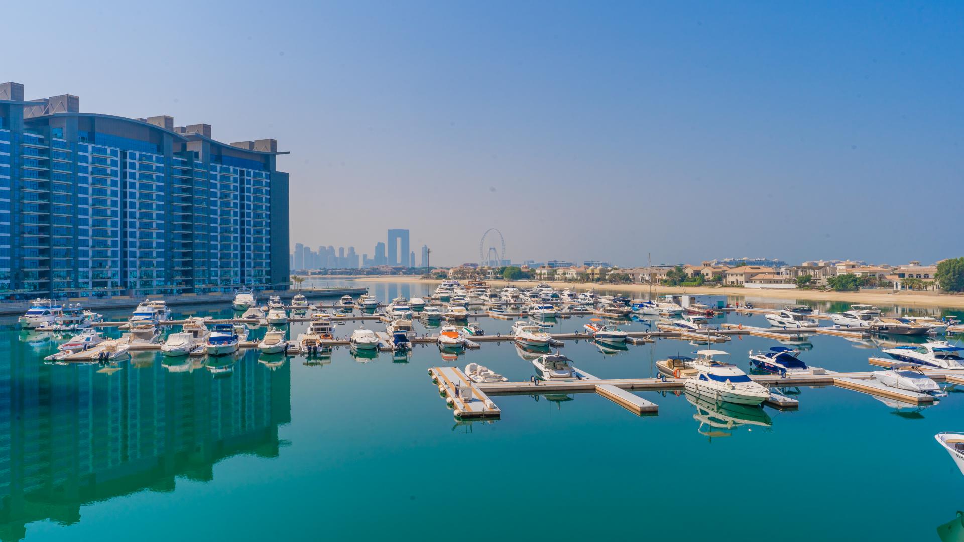 Renovated office space in luxury Palm Jumeirah apartment, modern decor and stylish furnishings