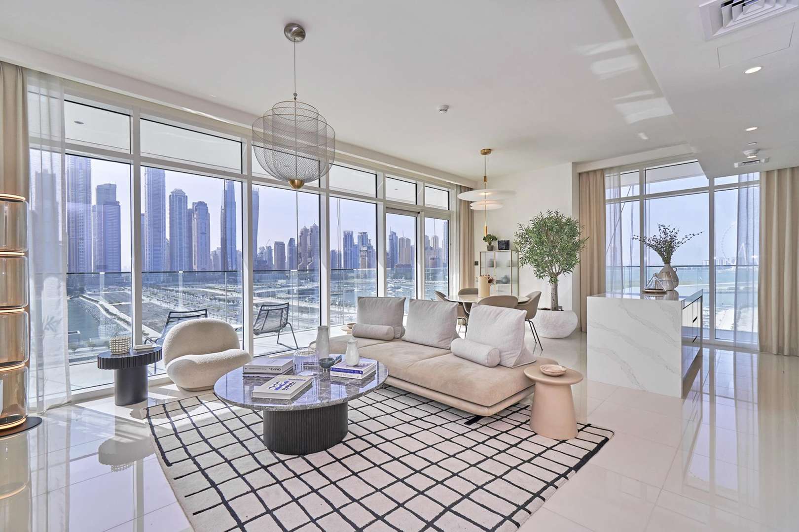 Furnished waterfront apartment balcony with city skyline view in Emaar Beachfront, Dubai Harbour